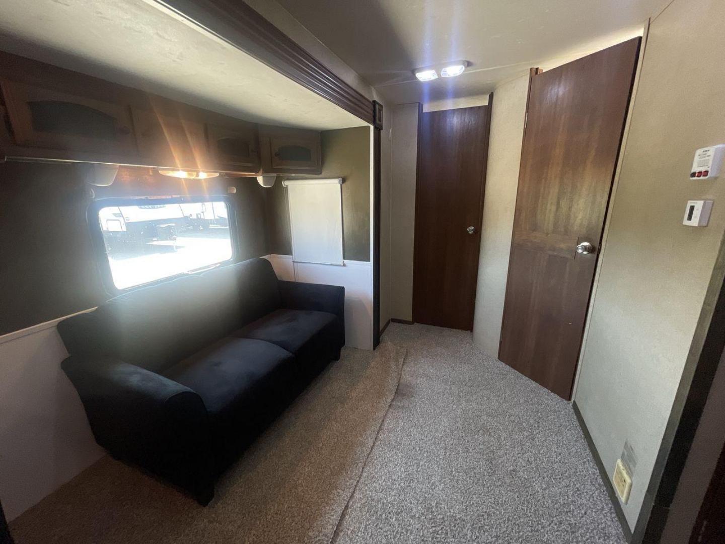 2015 TAN COACHMEN FREEDOM EXPRESS 320D (5ZT2FEXB6FA) , Length: 36.92 ft | Dry Weight: 7,374 lbs | Gross Weight: 10,700 lbs | Slides: 3 transmission, located at 4319 N Main Street, Cleburne, TX, 76033, (817) 221-0660, 32.435829, -97.384178 - The 2015 Coachmen Freedom Express 320BHDS travel trailer offers unsurpassed independence and comfort. With a length of 36.92 feet and three slides, this trailer provides ample living space for your entire family or company. Its aluminum body and fiberglass sidewalls are both robust and lightweight, - Photo#10