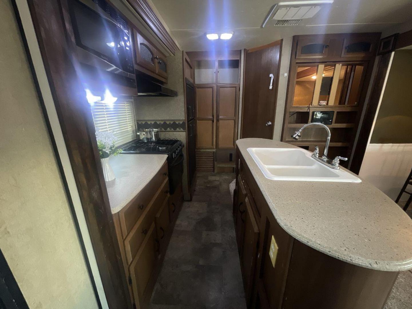 2015 TAN COACHMEN FREEDOM EXPRESS 320D (5ZT2FEXB6FA) , Length: 36.92 ft | Dry Weight: 7,374 lbs | Gross Weight: 10,700 lbs | Slides: 3 transmission, located at 4319 N Main Street, Cleburne, TX, 76033, (817) 221-0660, 32.435829, -97.384178 - The 2015 Coachmen Freedom Express 320BHDS travel trailer offers unsurpassed independence and comfort. With a length of 36.92 feet and three slides, this trailer provides ample living space for your entire family or company. Its aluminum body and fiberglass sidewalls are both robust and lightweight, - Photo#12