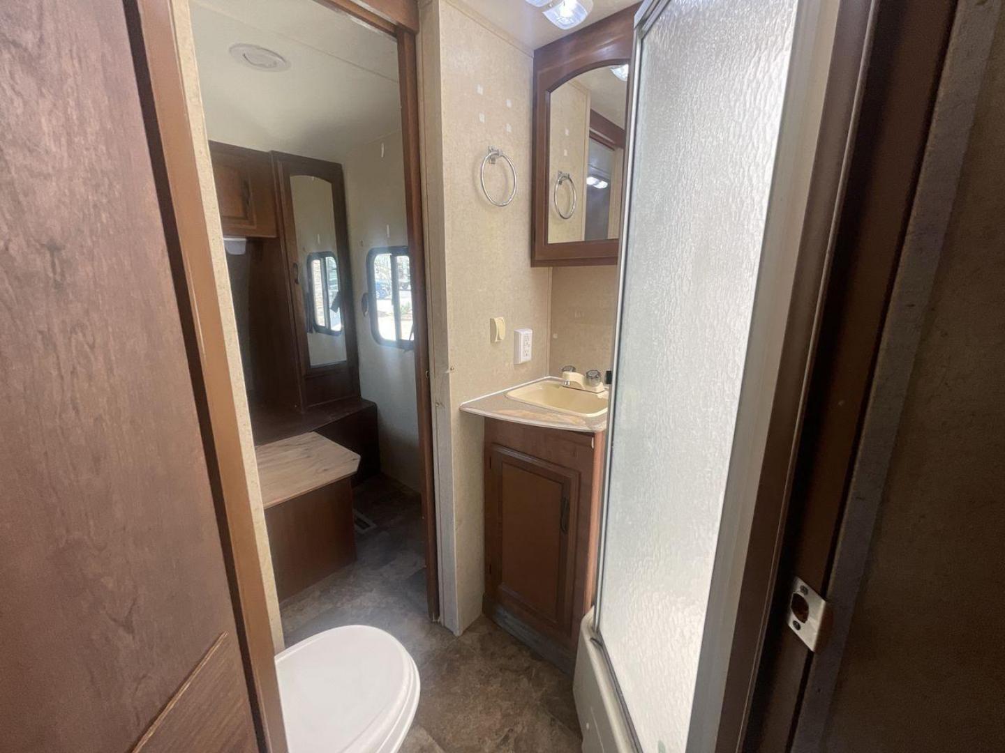 2015 TAN COACHMEN FREEDOM EXPRESS 320D (5ZT2FEXB6FA) , Length: 36.92 ft | Dry Weight: 7,374 lbs | Gross Weight: 10,700 lbs | Slides: 3 transmission, located at 4319 N Main Street, Cleburne, TX, 76033, (817) 221-0660, 32.435829, -97.384178 - The 2015 Coachmen Freedom Express 320BHDS travel trailer offers unsurpassed independence and comfort. With a length of 36.92 feet and three slides, this trailer provides ample living space for your entire family or company. Its aluminum body and fiberglass sidewalls are both robust and lightweight, - Photo#14