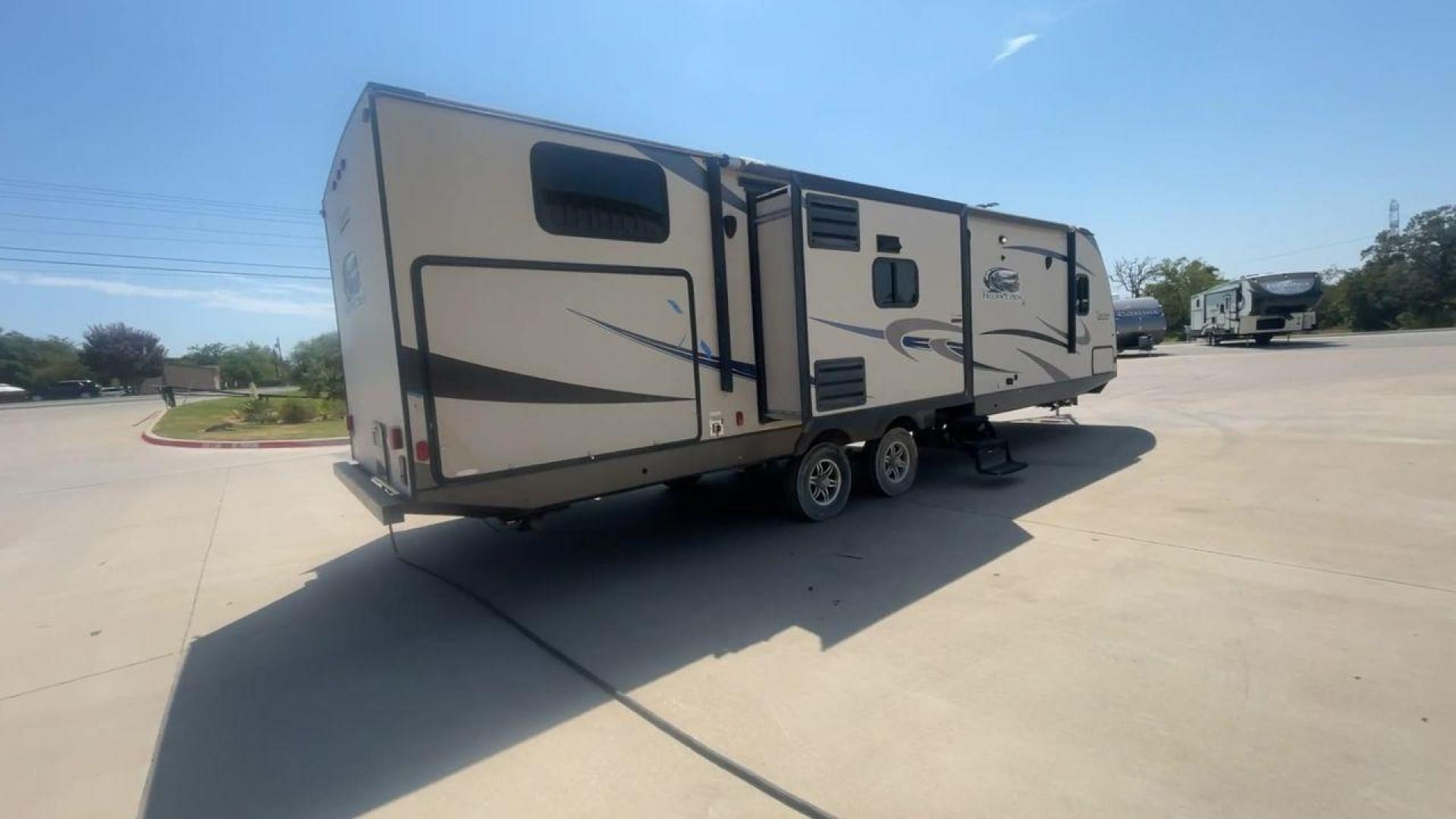 2015 TAN COACHMEN FREEDOM EXPRESS 320D (5ZT2FEXB6FA) , Length: 36.92 ft | Dry Weight: 7,374 lbs | Gross Weight: 10,700 lbs | Slides: 3 transmission, located at 4319 N Main Street, Cleburne, TX, 76033, (817) 221-0660, 32.435829, -97.384178 - The 2015 Coachmen Freedom Express 320BHDS travel trailer offers unsurpassed independence and comfort. With a length of 36.92 feet and three slides, this trailer provides ample living space for your entire family or company. Its aluminum body and fiberglass sidewalls are both robust and lightweight, - Photo#1