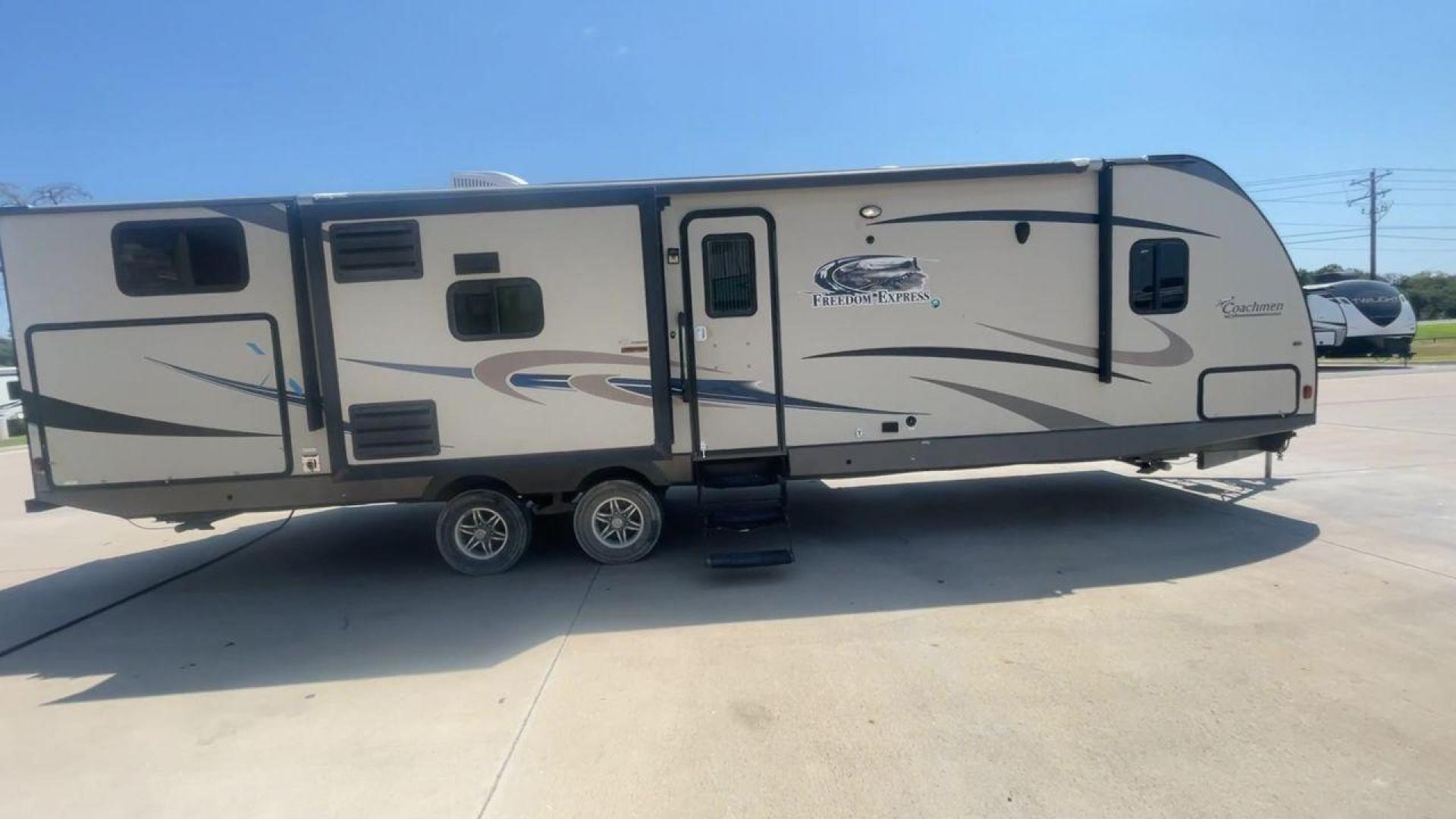 2015 TAN COACHMEN FREEDOM EXPRESS 320D (5ZT2FEXB6FA) , Length: 36.92 ft | Dry Weight: 7,374 lbs | Gross Weight: 10,700 lbs | Slides: 3 transmission, located at 4319 N Main Street, Cleburne, TX, 76033, (817) 221-0660, 32.435829, -97.384178 - The 2015 Coachmen Freedom Express 320BHDS travel trailer offers unsurpassed independence and comfort. With a length of 36.92 feet and three slides, this trailer provides ample living space for your entire family or company. Its aluminum body and fiberglass sidewalls are both robust and lightweight, - Photo#2