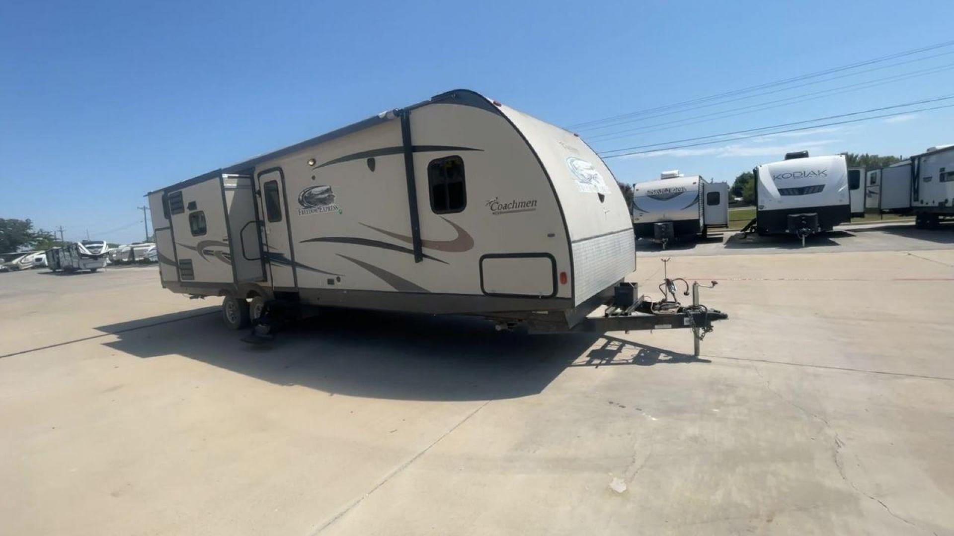 2015 TAN COACHMEN FREEDOM EXPRESS 320D (5ZT2FEXB6FA) , Length: 36.92 ft | Dry Weight: 7,374 lbs | Gross Weight: 10,700 lbs | Slides: 3 transmission, located at 4319 N Main Street, Cleburne, TX, 76033, (817) 221-0660, 32.435829, -97.384178 - The 2015 Coachmen Freedom Express 320BHDS travel trailer offers unsurpassed independence and comfort. With a length of 36.92 feet and three slides, this trailer provides ample living space for your entire family or company. Its aluminum body and fiberglass sidewalls are both robust and lightweight, - Photo#3