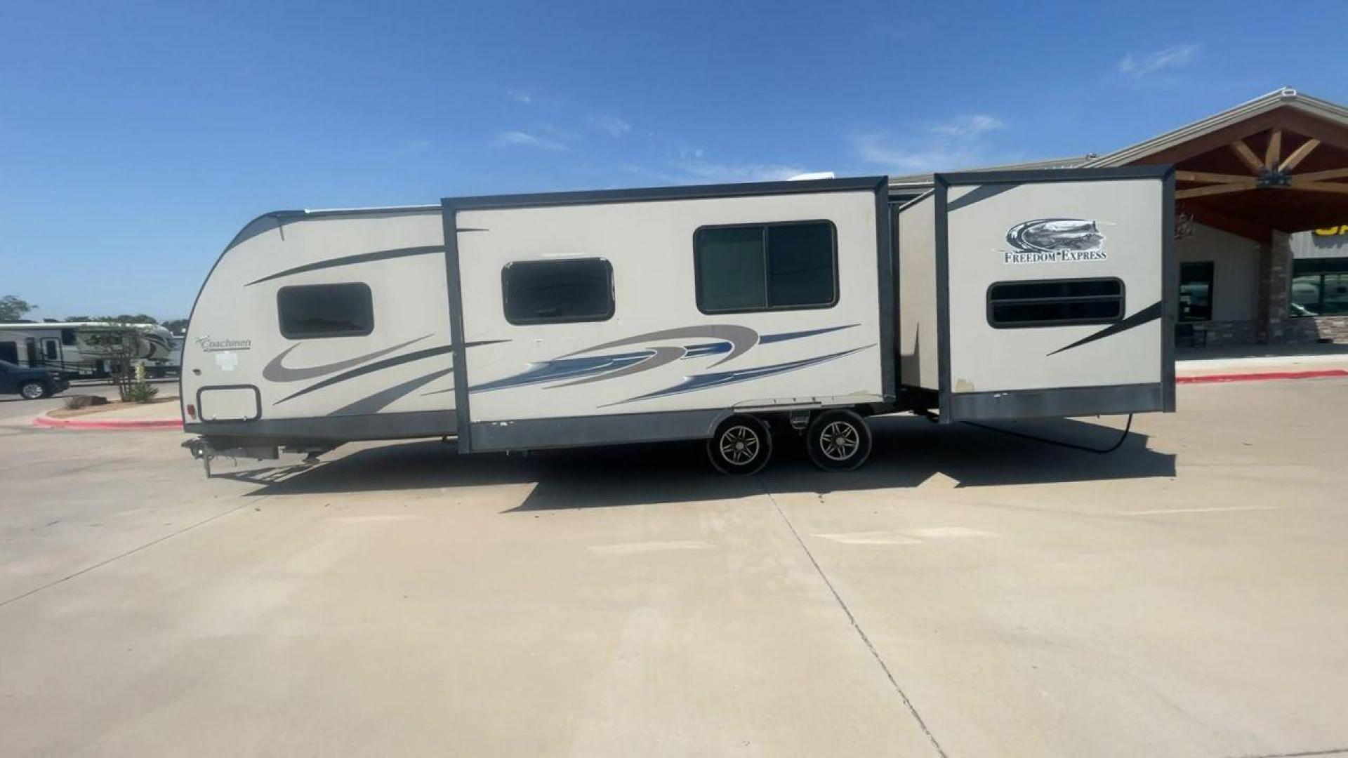 2015 TAN COACHMEN FREEDOM EXPRESS 320D (5ZT2FEXB6FA) , Length: 36.92 ft | Dry Weight: 7,374 lbs | Gross Weight: 10,700 lbs | Slides: 3 transmission, located at 4319 N Main Street, Cleburne, TX, 76033, (817) 221-0660, 32.435829, -97.384178 - The 2015 Coachmen Freedom Express 320BHDS travel trailer offers unsurpassed independence and comfort. With a length of 36.92 feet and three slides, this trailer provides ample living space for your entire family or company. Its aluminum body and fiberglass sidewalls are both robust and lightweight, - Photo#6