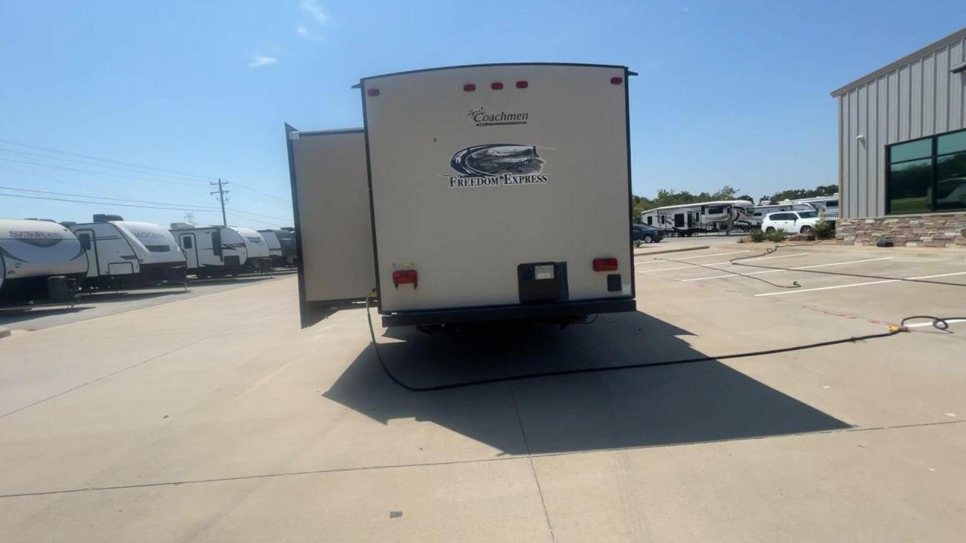 2015 TAN COACHMEN FREEDOM EXPRESS 320D (5ZT2FEXB6FA) , Length: 36.92 ft | Dry Weight: 7,374 lbs | Gross Weight: 10,700 lbs | Slides: 3 transmission, located at 4319 N Main Street, Cleburne, TX, 76033, (817) 221-0660, 32.435829, -97.384178 - The 2015 Coachmen Freedom Express 320BHDS travel trailer offers unsurpassed independence and comfort. With a length of 36.92 feet and three slides, this trailer provides ample living space for your entire family or company. Its aluminum body and fiberglass sidewalls are both robust and lightweight, - Photo#8