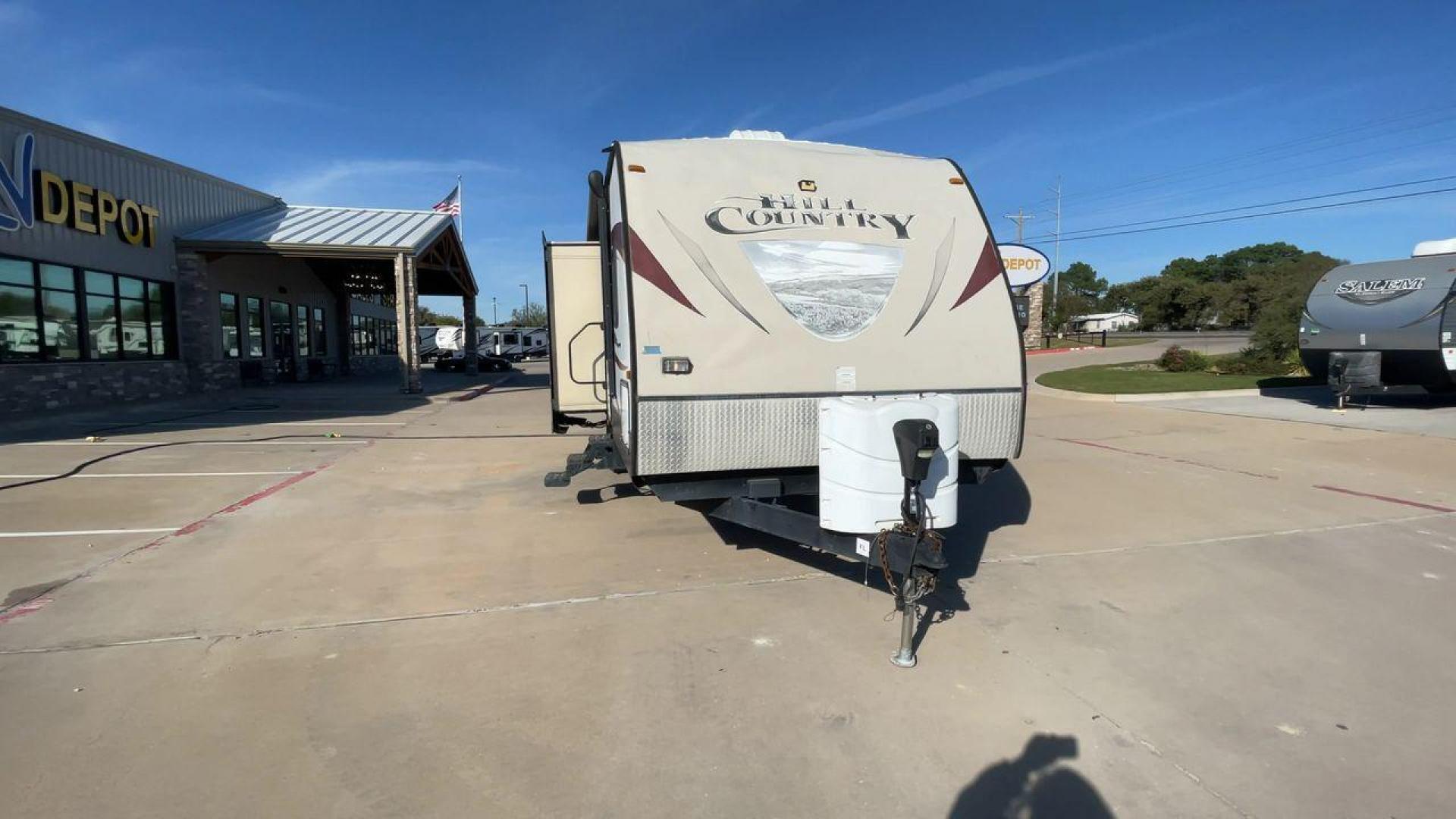 2015 WHITE CROSSROADS HILL COUNTRY 26RB (4V0TC2626FB) , Length: 27.58 ft. | Dry Weight: 7,334 lbs. | Gross Weight: 9,494 lbs. | Slides: 2 transmission, located at 4319 N Main Street, Cleburne, TX, 76033, (817) 221-0660, 32.435829, -97.384178 - This 2015 Hill Country 26RB travel trailer is just over 30' long. It is a dual axle, aluminum wheel setup with a dry weight of 6,284 lbs and a carrying capacity of 3,210 lbs. This travel trailer has two slides. The main area contains the kitchen, living area, and dining area. The kitchen has an isla - Photo#4