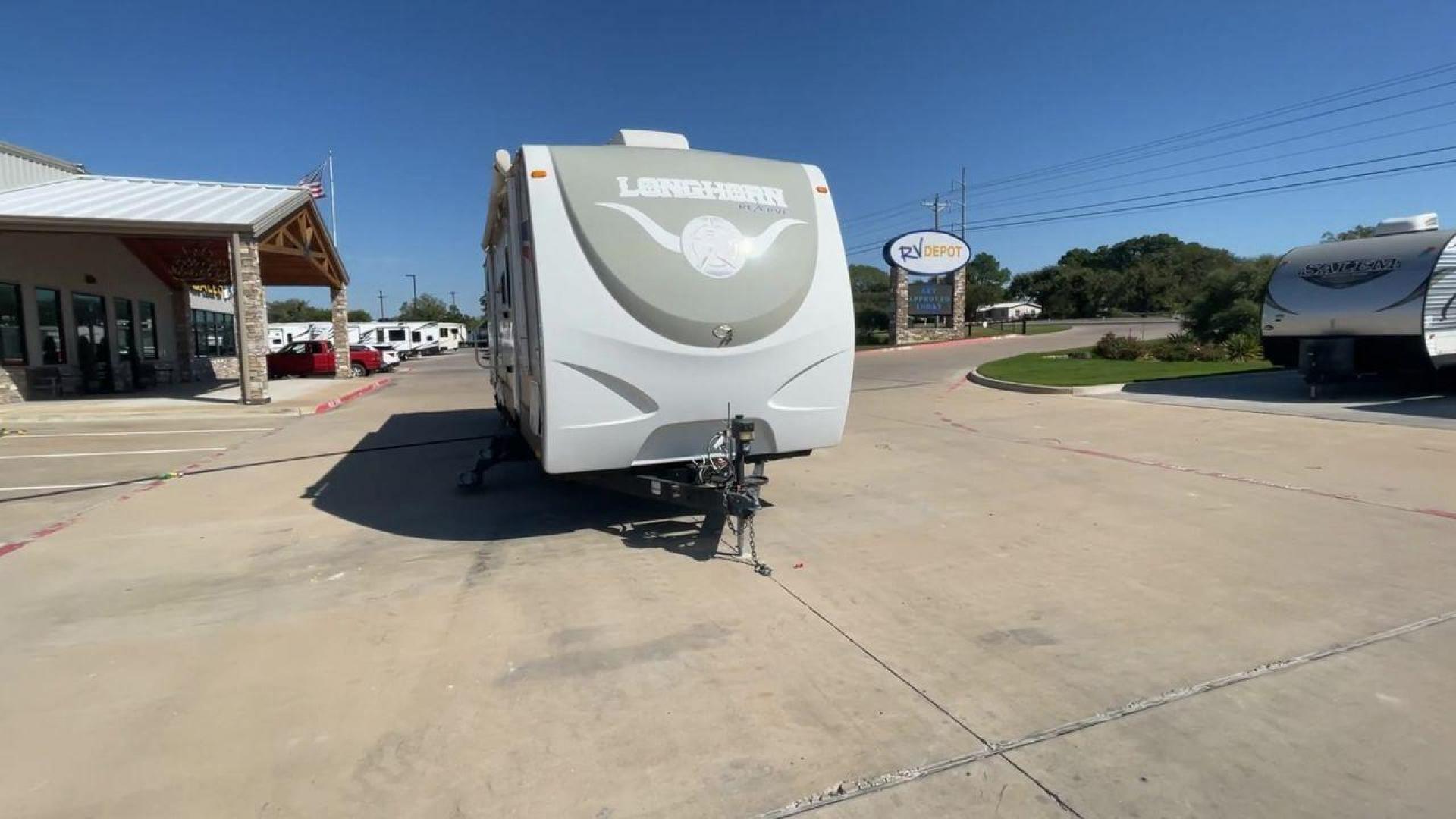 2015 CROSSROADS LONGHORN 31SB (4V0TC3124FE) , Length: 35.5 ft. | Dry Weight: 7,875 lbs. | Gross Weight: 9,671 lbs. | Slides: 2 transmission, located at 4319 N Main Street, Cleburne, TX, 76033, (817) 221-0660, 32.435829, -97.384178 - The 2015 Crossroads Longhorn 31SB is a well-crafted travel trailer with thoughtful design features and ample space, making it a great choice for families or groups looking for comfort on the road. The exterior of the Crossroads Longhorn 31SB is sleek and modern with a white body and tasteful accents - Photo#4