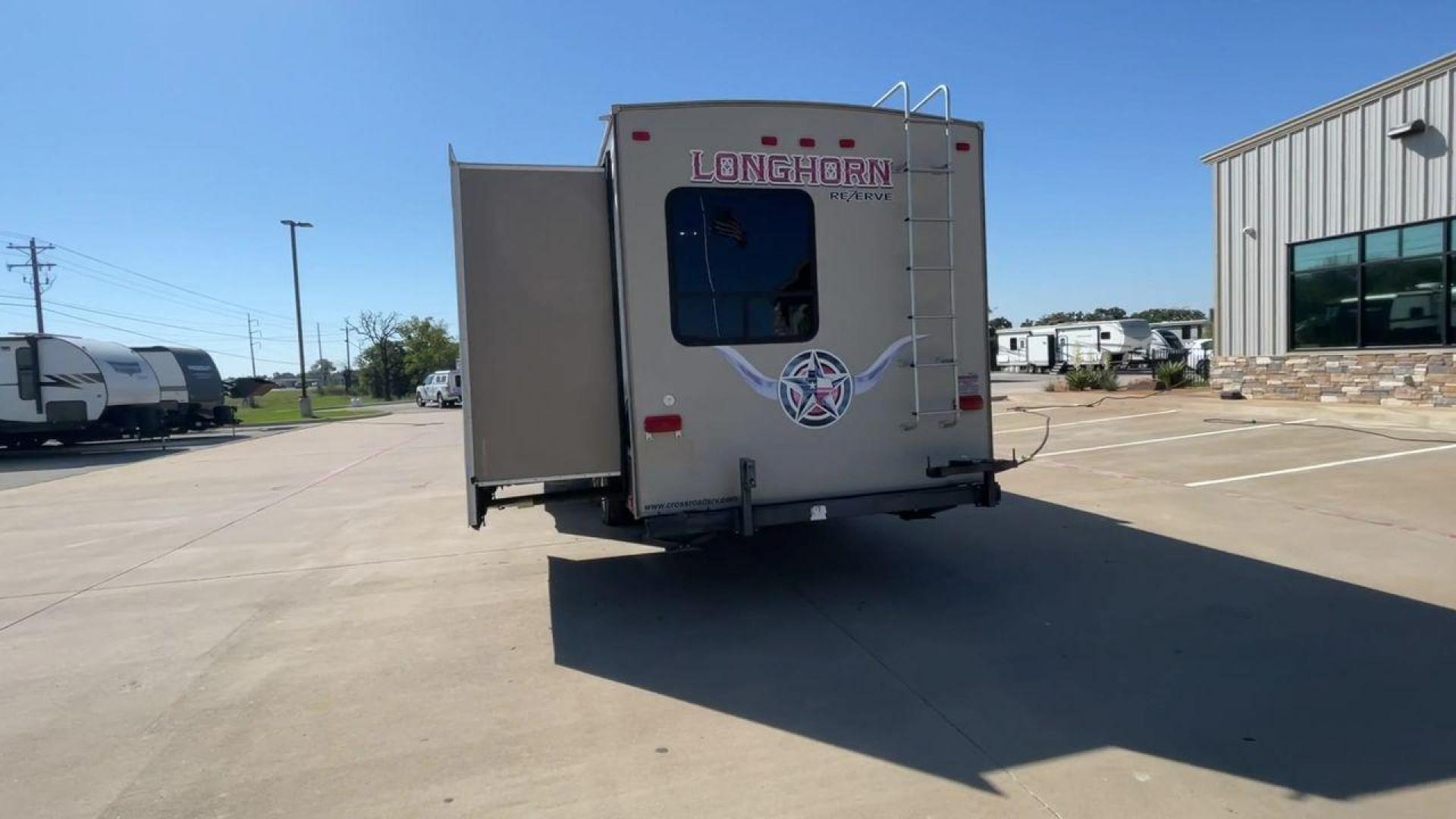 2015 CROSSROADS LONGHORN 31SB (4V0TC3124FE) , Length: 35.5 ft. | Dry Weight: 7,875 lbs. | Gross Weight: 9,671 lbs. | Slides: 2 transmission, located at 4319 N Main Street, Cleburne, TX, 76033, (817) 221-0660, 32.435829, -97.384178 - The 2015 Crossroads Longhorn 31SB is a well-crafted travel trailer with thoughtful design features and ample space, making it a great choice for families or groups looking for comfort on the road. The exterior of the Crossroads Longhorn 31SB is sleek and modern with a white body and tasteful accents - Photo#8