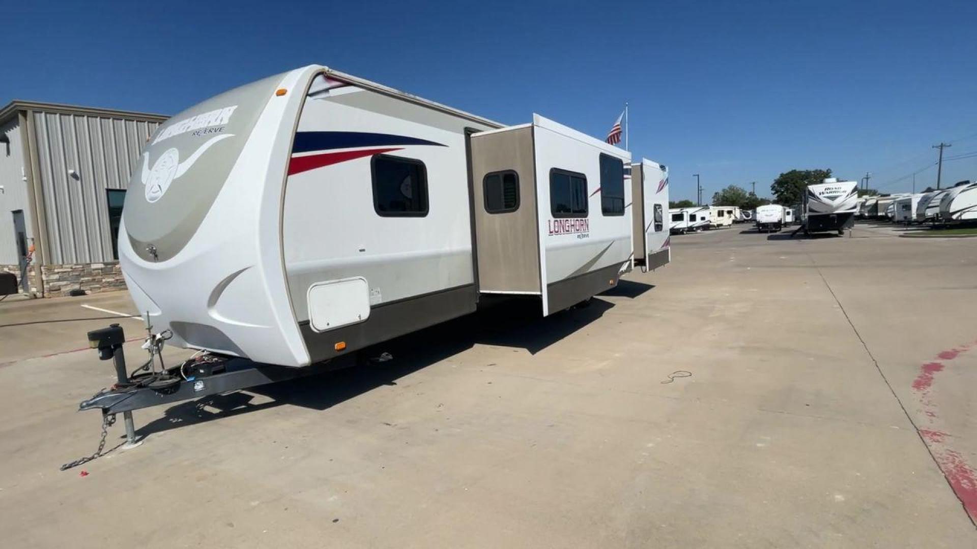 2015 CROSSROADS LONGHORN 31SB (4V0TC3124FE) , Length: 35.5 ft. | Dry Weight: 7,875 lbs. | Gross Weight: 9,671 lbs. | Slides: 2 transmission, located at 4319 N Main Street, Cleburne, TX, 76033, (817) 221-0660, 32.435829, -97.384178 - The 2015 Crossroads Longhorn 31SB is a well-crafted travel trailer with thoughtful design features and ample space, making it a great choice for families or groups looking for comfort on the road. The exterior of the Crossroads Longhorn 31SB is sleek and modern with a white body and tasteful accents - Photo#4