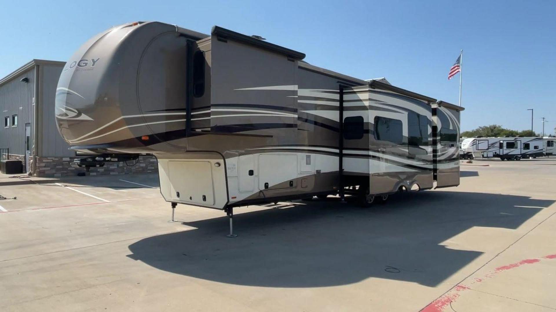 2015 TAN DYNAMAX TRILOGY 37BH - (5ZT3TL2B8FC) , Length: 42 ft. | Dry Weight: 15,638 lbs. | Gross Weight: 18,550 lbs. | Slides: 5 transmission, located at 4319 N Main Street, Cleburne, TX, 76033, (817) 221-0660, 32.435829, -97.384178 - This 2015 Trilogy Dynamax 37BH fifth wheel has 42.9 ft in length, 8.4 ft in width, and 13.2 ft in height. It has a dry weight of 15,638 lbs with a GVWR of 18,550 lbs and a hitch weight of 2,550 lbs. The exterior features a front storage capacity with a generator prep. It has extra-large pass-through - Photo#5