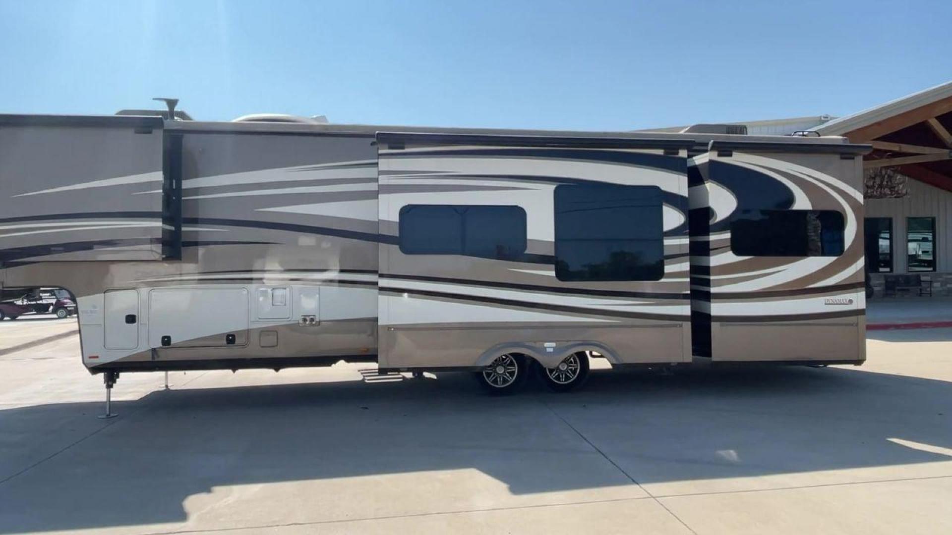 2015 TAN DYNAMAX TRILOGY 37BH - (5ZT3TL2B8FC) , Length: 42 ft. | Dry Weight: 15,638 lbs. | Gross Weight: 18,550 lbs. | Slides: 5 transmission, located at 4319 N Main Street, Cleburne, TX, 76033, (817) 221-0660, 32.435829, -97.384178 - This 2015 Trilogy Dynamax 37BH fifth wheel has 42.9 ft in length, 8.4 ft in width, and 13.2 ft in height. It has a dry weight of 15,638 lbs with a GVWR of 18,550 lbs and a hitch weight of 2,550 lbs. The exterior features a front storage capacity with a generator prep. It has extra-large pass-through - Photo#6