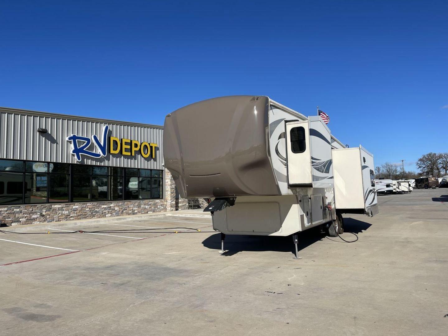 2015 TAN FOREST RIVER CEDAR CREEK 29RE (4X4FCRE21FS) , Length: 33.92 ft. | Dry Weight: 9,790 lbs. | Gross Weight: 13,615 lbs. | Slides: 3 transmission, located at 4319 N Main Street, Cleburne, TX, 76033, (817) 221-0660, 32.435829, -97.384178 - The 2015 Forest River Cedar Creek Silverback 29RE is a 33 ft trailer with three slides that offers a spacious and inviting interior, perfect for both short getaways and extended adventures. When you walk inside, you'll be met by beautiful furniture and well-thought-out design elements that make camp - Photo#0