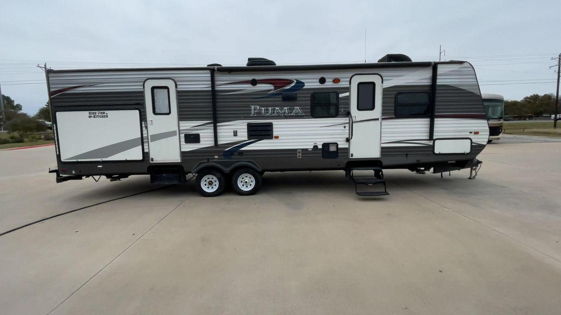 2015 FOREST RIVER PUMA 31BHSS (4X4TPUG21FP) , Length: 35.33 ft. | Dry Weight: 7,702 lbs. | Gross Weight: 10,236 lbs. | Slides: 2 transmission, located at 4319 N Main Street, Cleburne, TX, 76033, (817) 221-0660, 32.435829, -97.384178 - The 2015 Forest River Puma 31BH RV features a classic and durable exterior design. The body of the RV is a combination of gray, white, and black with accents of maroon, which gives it a rugged yet stylish look. The sides have aluminum panels with a ribbed texture, which not only adds to the aestheti - Photo#2