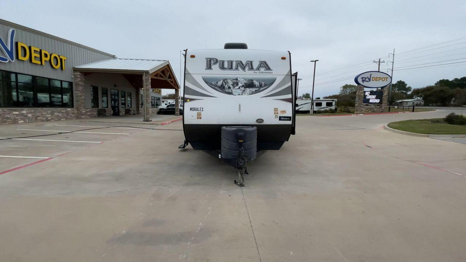 2015 FOREST RIVER PUMA 31BHSS (4X4TPUG21FP) , Length: 35.33 ft. | Dry Weight: 7,702 lbs. | Gross Weight: 10,236 lbs. | Slides: 2 transmission, located at 4319 N Main Street, Cleburne, TX, 76033, (817) 221-0660, 32.435829, -97.384178 - The 2015 Forest River Puma 31BH RV features a classic and durable exterior design. The body of the RV is a combination of gray, white, and black with accents of maroon, which gives it a rugged yet stylish look. The sides have aluminum panels with a ribbed texture, which not only adds to the aestheti - Photo#4