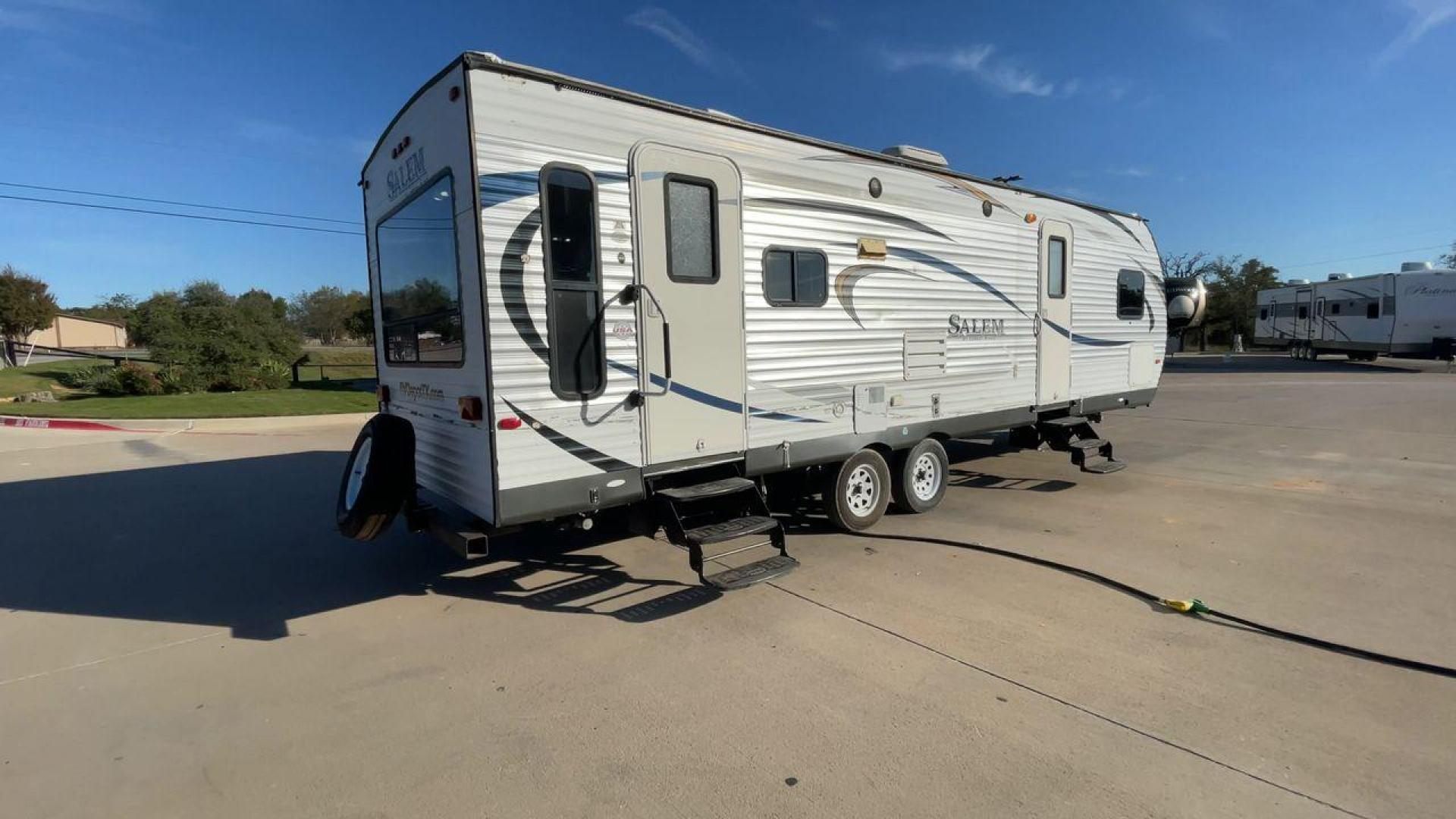 2015 GRAY FOREST RIVER SALEM - (4X4TSMD2XFA) , Length: 31.67 ft. | Dry Weight: 7,394 lbs. | Slides: 2 transmission, located at 4319 N Main Street, Cleburne, TX, 76033, (817) 221-0660, 32.435829, -97.384178 - RV Depot in Cleburne, TX is offering a fantastic deal on a 2015 FOREST RIVER SALEM travel trailer. Priced at just $27,995, this spacious and comfortable RV is perfect for those looking to hit the road and explore the local driving highlights around Cleburne, TX. The exterior of this travel trailer - Photo#1