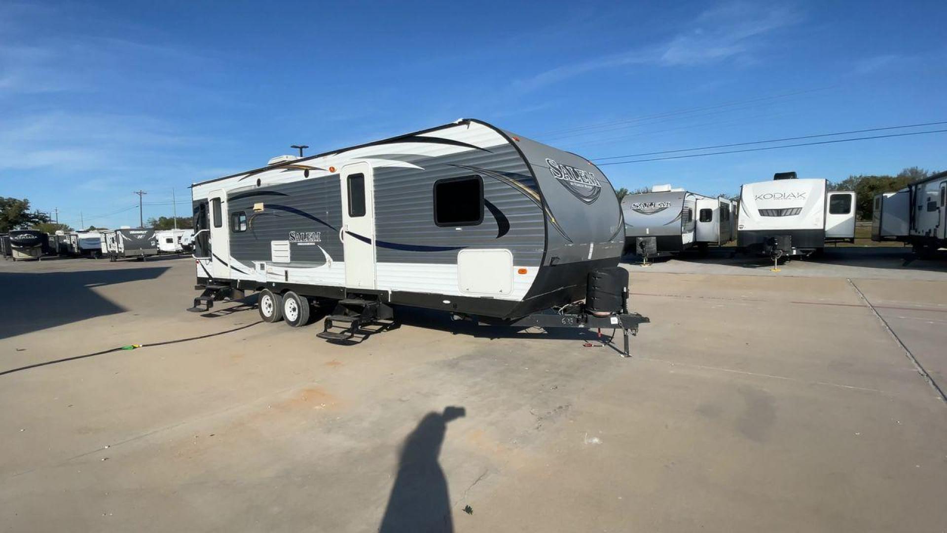 2015 GRAY FOREST RIVER SALEM - (4X4TSMD2XFA) , Length: 31.67 ft. | Dry Weight: 7,394 lbs. | Slides: 2 transmission, located at 4319 N Main Street, Cleburne, TX, 76033, (817) 221-0660, 32.435829, -97.384178 - RV Depot in Cleburne, TX is offering a fantastic deal on a 2015 FOREST RIVER SALEM travel trailer. Priced at just $27,995, this spacious and comfortable RV is perfect for those looking to hit the road and explore the local driving highlights around Cleburne, TX. The exterior of this travel trailer - Photo#3