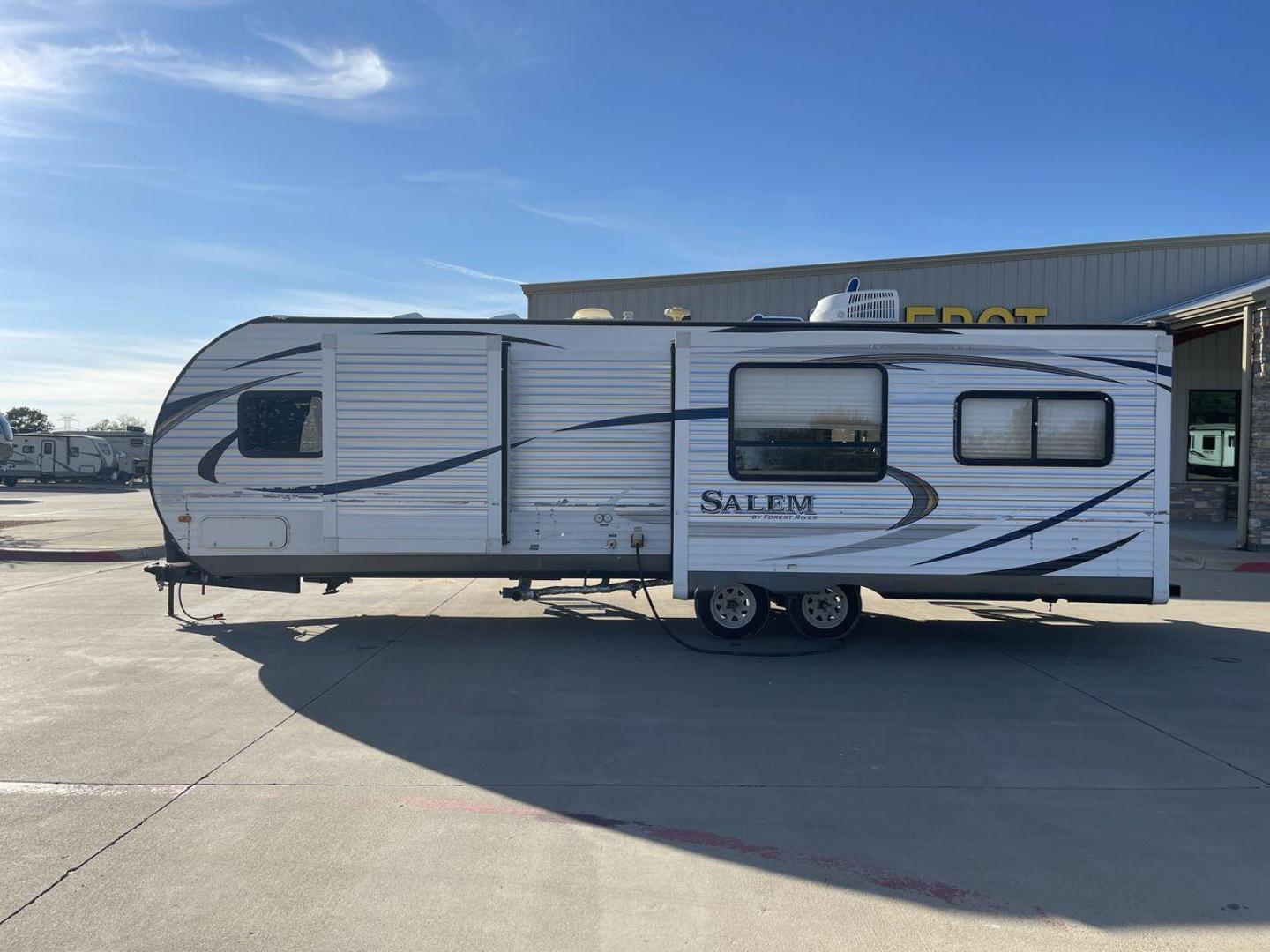 2015 GRAY FOREST RIVER SALEM - (4X4TSMD2XFA) , Length: 31.67 ft. | Dry Weight: 7,394 lbs. | Slides: 2 transmission, located at 4319 N Main Street, Cleburne, TX, 76033, (817) 221-0660, 32.435829, -97.384178 - RV Depot in Cleburne, TX is offering a fantastic deal on a 2015 FOREST RIVER SALEM travel trailer. Priced at just $27,995, this spacious and comfortable RV is perfect for those looking to hit the road and explore the local driving highlights around Cleburne, TX. The exterior of this travel trailer - Photo#22