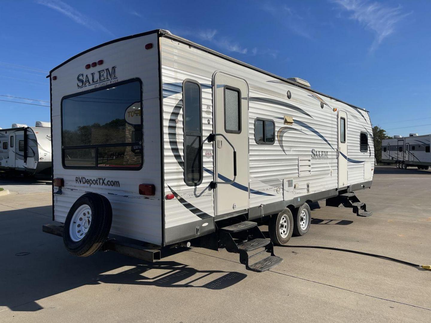 2015 GRAY FOREST RIVER SALEM - (4X4TSMD2XFA) , Length: 31.67 ft. | Dry Weight: 7,394 lbs. | Slides: 2 transmission, located at 4319 N Main Street, Cleburne, TX, 76033, (817) 221-0660, 32.435829, -97.384178 - RV Depot in Cleburne, TX is offering a fantastic deal on a 2015 FOREST RIVER SALEM travel trailer. Priced at just $27,995, this spacious and comfortable RV is perfect for those looking to hit the road and explore the local driving highlights around Cleburne, TX. The exterior of this travel trailer - Photo#23