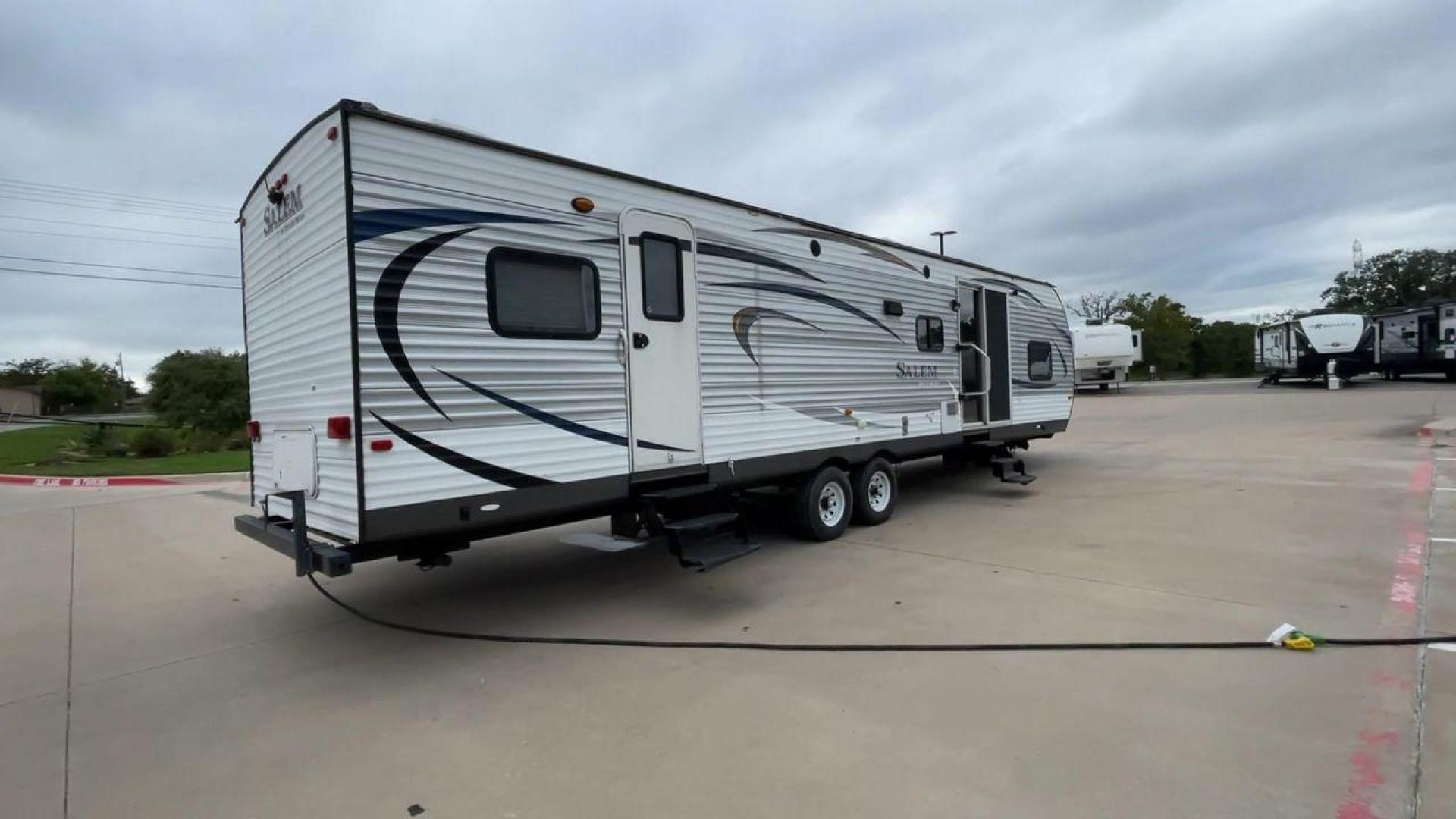 2015 FOREST RIVER SALEM 36BHBS (4X4TSMM24FA) , Length: 36.58 ft. | Dry Weight: 7,892 lbs. | Slides: 2 transmission, located at 4319 N Main Street, Cleburne, TX, 76033, (817) 221-0660, 32.435829, -97.384178 - The 2015 Forest River Salem 36BHBS is a spacious and versatile travel trailer designed for comfort and convenience during family adventures. With a length of 36.58 feet and a dry weight of 7,892 lbs., this model offers ample living space and features that make it perfect for long vacations or weeken - Photo#1