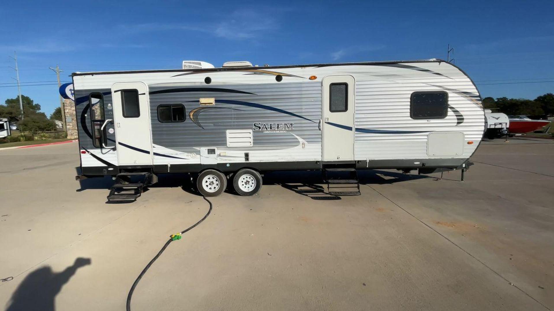 2015 GRAY FOREST RIVER SALEM 28RLDS - (4X4TSMD2XFA) , Length: 31.67 ft. | Dry Weight: 7,394 lbs. | Slides: 2 transmission, located at 4319 N Main Street, Cleburne, TX, 76033, (817) 221-0660, 32.435829, -97.384178 - RV Depot in Cleburne, TX is offering a fantastic deal on a 2015 FOREST RIVER SALEM travel trailer. Priced at just $27,995, this spacious and comfortable RV is perfect for those looking to hit the road and explore the local driving highlights around Cleburne, TX. The exterior of this travel trailer - Photo#2