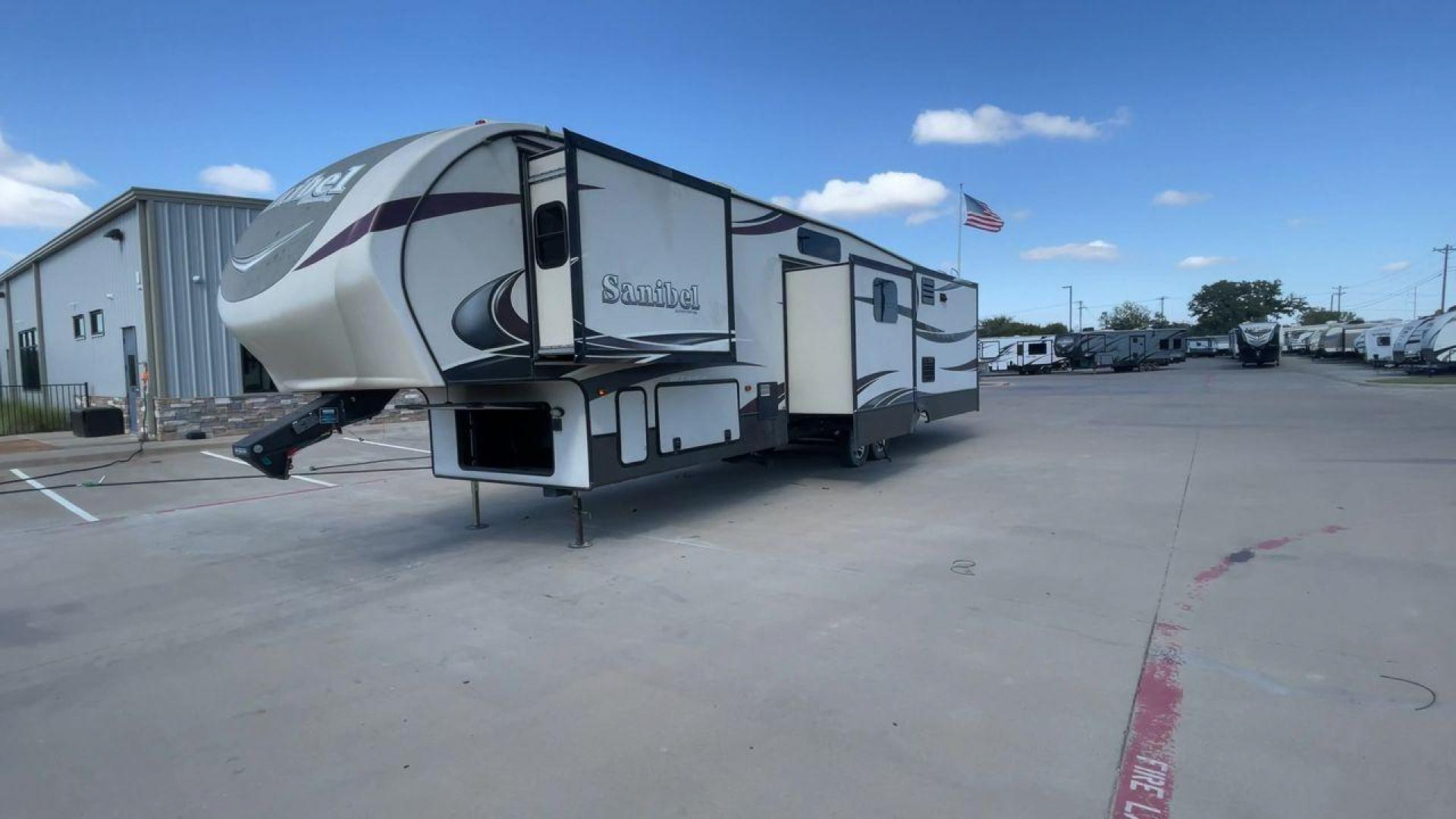 2015 FOREST RIVER SANIBEL 38QB (5ZT3SN3B4FG) , Length: 42.5 ft. | Dry Weight: 12,913 lbs. | Slides: 4 transmission, located at 4319 N Main Street, Cleburne, TX, 76033, (817) 221-0660, 32.435829, -97.384178 - The 2015 Prime Time Sanibel 38QB stands out with its spacious and functional design. It measures 42.5 feet in length and weighs 12,913 pounds. This fifth wheel features four slides that significantly expand the interior space. Its exterior showcases an aerodynamic front cap and stylish graphics. Ins - Photo#5