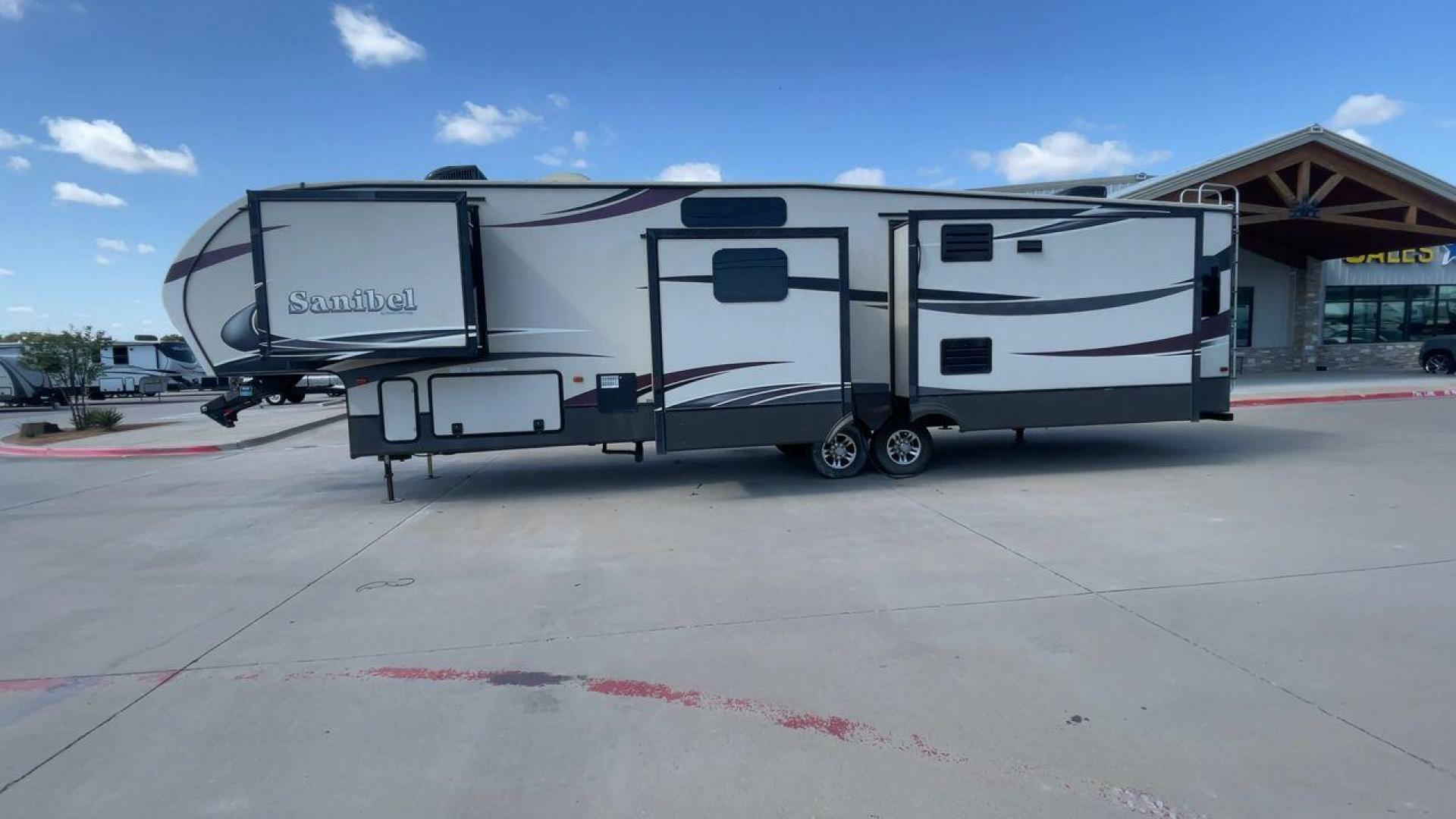 2015 FOREST RIVER SANIBEL 38QB (5ZT3SN3B4FG) , Length: 42.5 ft. | Dry Weight: 12,913 lbs. | Slides: 4 transmission, located at 4319 N Main Street, Cleburne, TX, 76033, (817) 221-0660, 32.435829, -97.384178 - The 2015 Prime Time Sanibel 38QB stands out with its spacious and functional design. It measures 42.5 feet in length and weighs 12,913 pounds. This fifth wheel features four slides that significantly expand the interior space. Its exterior showcases an aerodynamic front cap and stylish graphics. Ins - Photo#6