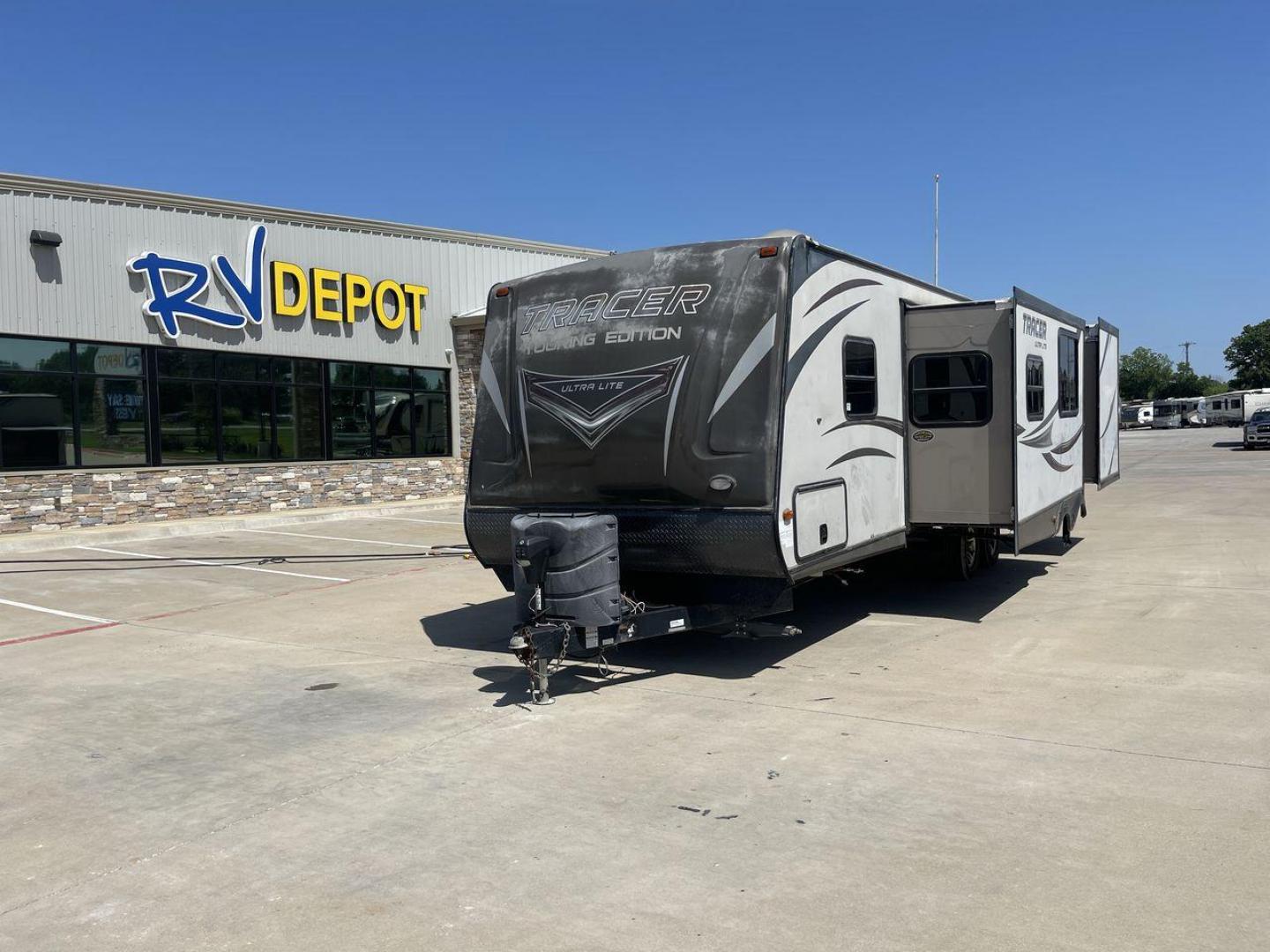 2015 WHITE FOREST RIVER TRACER 3150BHD (5ZT2TRXB5FB) , Length: 34 ft. | Dry Weight: 6,955 lbs. | Slides: 2 transmission, located at 4319 N Main Street, Cleburne, TX, 76033, (817) 221-0660, 32.435829, -97.384178 - In this 2015 Forest River Tracer 3150BHD, you are guaranteed more campers, more features, and more fun! This travel trailer measures exactly 34 ft. in length with a dry weight of 6,955 lbs. and a payload capacity of 2,755 lbs. It includes two doors, two slides, and one awning. This model featu - Photo#0