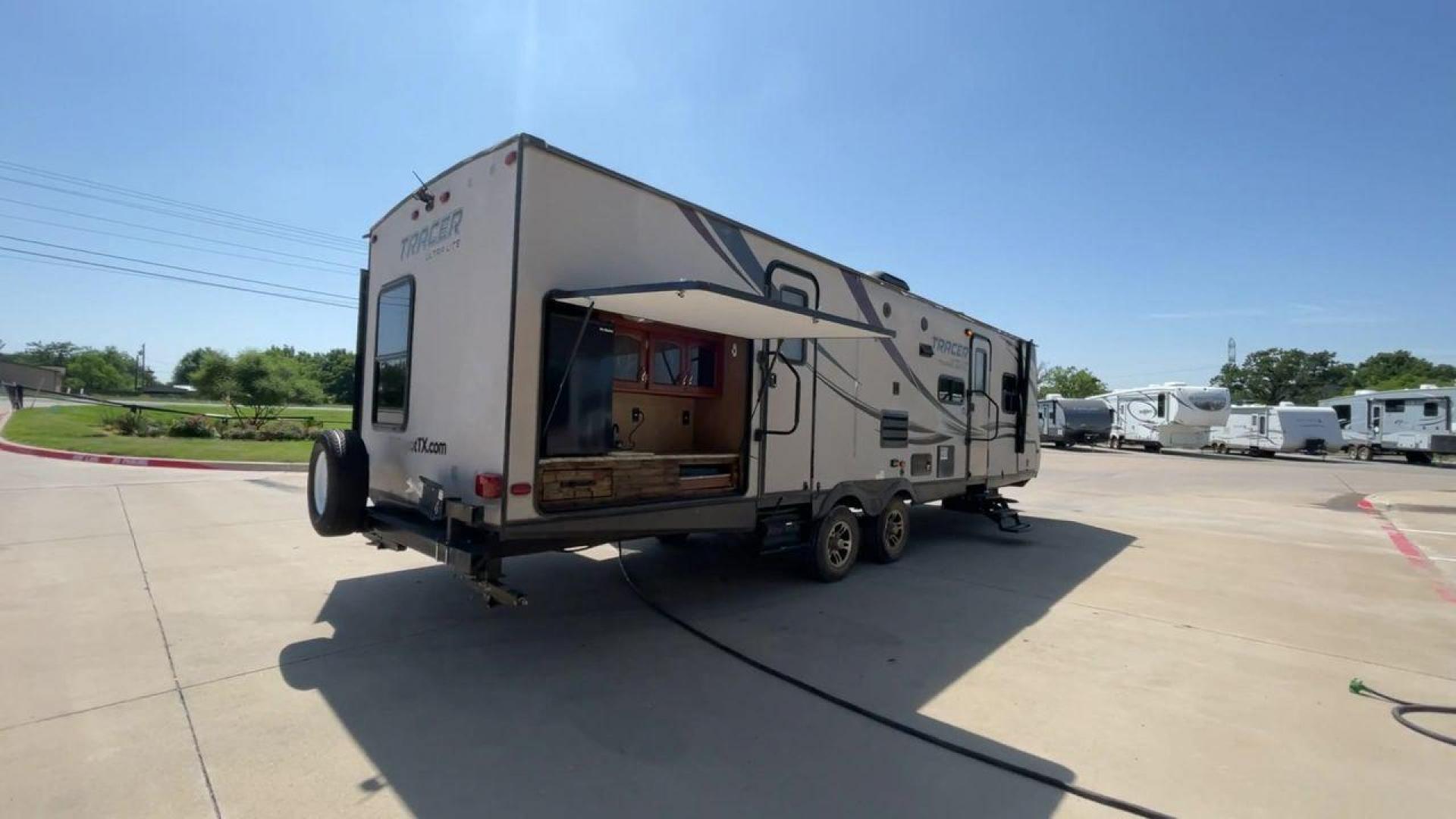 2015 WHITE FOREST RIVER TRACER 3150BHD (5ZT2TRXB5FB) , Length: 34 ft. | Dry Weight: 6,955 lbs. | Slides: 2 transmission, located at 4319 N Main Street, Cleburne, TX, 76033, (817) 221-0660, 32.435829, -97.384178 - In this 2015 Forest River Tracer 3150BHD, you are guaranteed more campers, more features, and more fun! This travel trailer measures exactly 34 ft. in length with a dry weight of 6,955 lbs. and a payload capacity of 2,755 lbs. It includes two doors, two slides, and one awning. This model featu - Photo#1