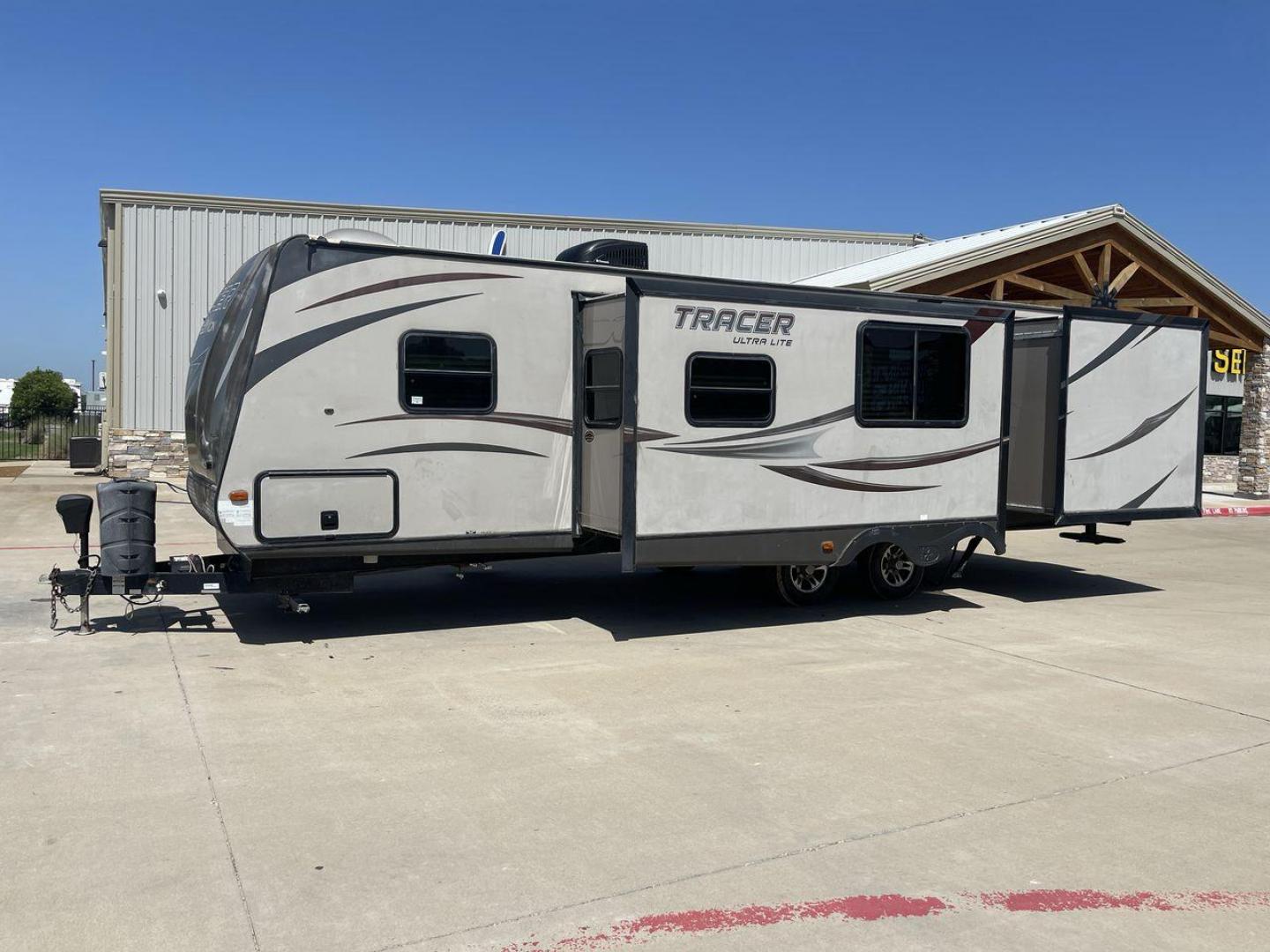 2015 WHITE FOREST RIVER TRACER 3150BHD (5ZT2TRXB5FB) , Length: 34 ft. | Dry Weight: 6,955 lbs. | Slides: 2 transmission, located at 4319 N Main Street, Cleburne, TX, 76033, (817) 221-0660, 32.435829, -97.384178 - In this 2015 Forest River Tracer 3150BHD, you are guaranteed more campers, more features, and more fun! This travel trailer measures exactly 34 ft. in length with a dry weight of 6,955 lbs. and a payload capacity of 2,755 lbs. It includes two doors, two slides, and one awning. This model featu - Photo#25