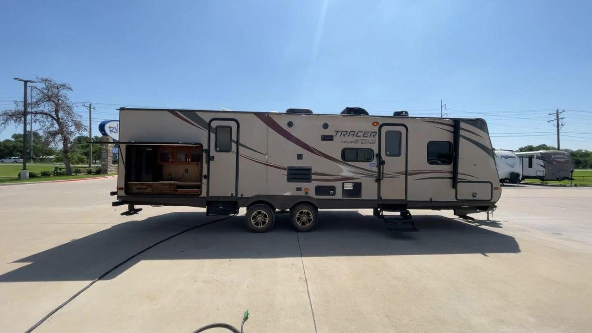 2015 WHITE FOREST RIVER TRACER 3150BHD (5ZT2TRXB5FB) , Length: 34 ft. | Dry Weight: 6,955 lbs. | Slides: 2 transmission, located at 4319 N Main Street, Cleburne, TX, 76033, (817) 221-0660, 32.435829, -97.384178 - In this 2015 Forest River Tracer 3150BHD, you are guaranteed more campers, more features, and more fun! This travel trailer measures exactly 34 ft. in length with a dry weight of 6,955 lbs. and a payload capacity of 2,755 lbs. It includes two doors, two slides, and one awning. This model featu - Photo#2