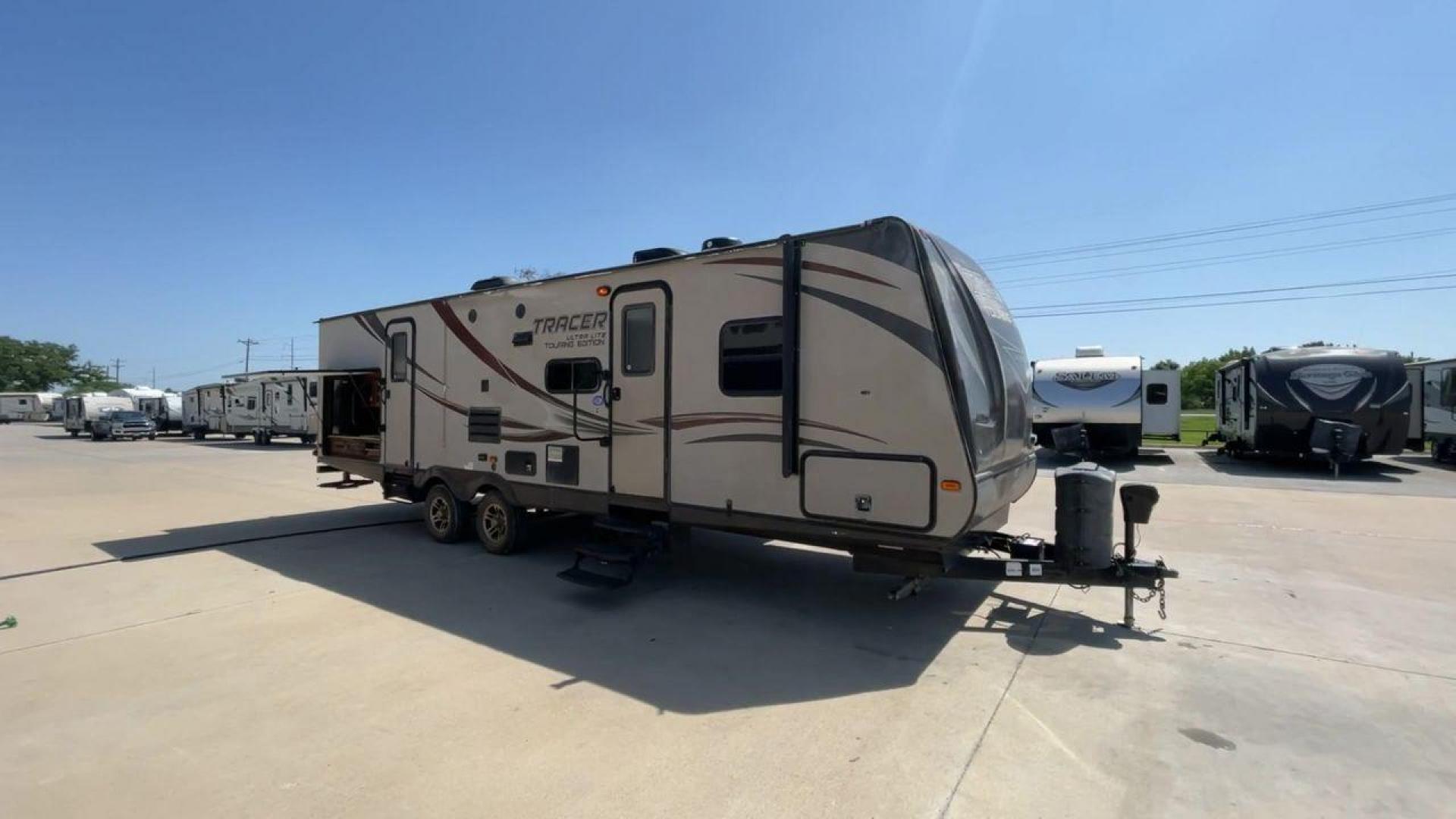 2015 WHITE FOREST RIVER TRACER 3150BHD (5ZT2TRXB5FB) , Length: 34 ft. | Dry Weight: 6,955 lbs. | Slides: 2 transmission, located at 4319 N Main Street, Cleburne, TX, 76033, (817) 221-0660, 32.435829, -97.384178 - In this 2015 Forest River Tracer 3150BHD, you are guaranteed more campers, more features, and more fun! This travel trailer measures exactly 34 ft. in length with a dry weight of 6,955 lbs. and a payload capacity of 2,755 lbs. It includes two doors, two slides, and one awning. This model featu - Photo#3