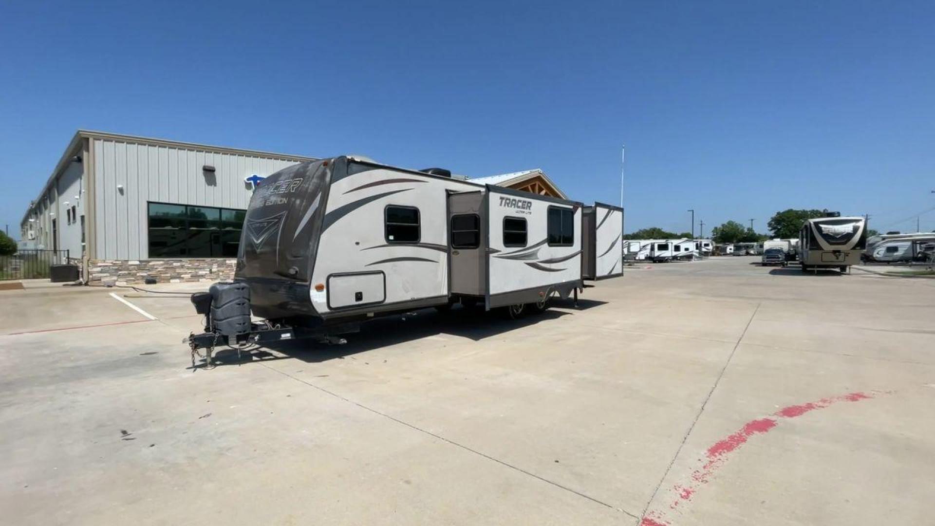 2015 WHITE FOREST RIVER TRACER 3150BHD (5ZT2TRXB5FB) , Length: 34 ft. | Dry Weight: 6,955 lbs. | Slides: 2 transmission, located at 4319 N Main Street, Cleburne, TX, 76033, (817) 221-0660, 32.435829, -97.384178 - In this 2015 Forest River Tracer 3150BHD, you are guaranteed more campers, more features, and more fun! This travel trailer measures exactly 34 ft. in length with a dry weight of 6,955 lbs. and a payload capacity of 2,755 lbs. It includes two doors, two slides, and one awning. This model featu - Photo#5