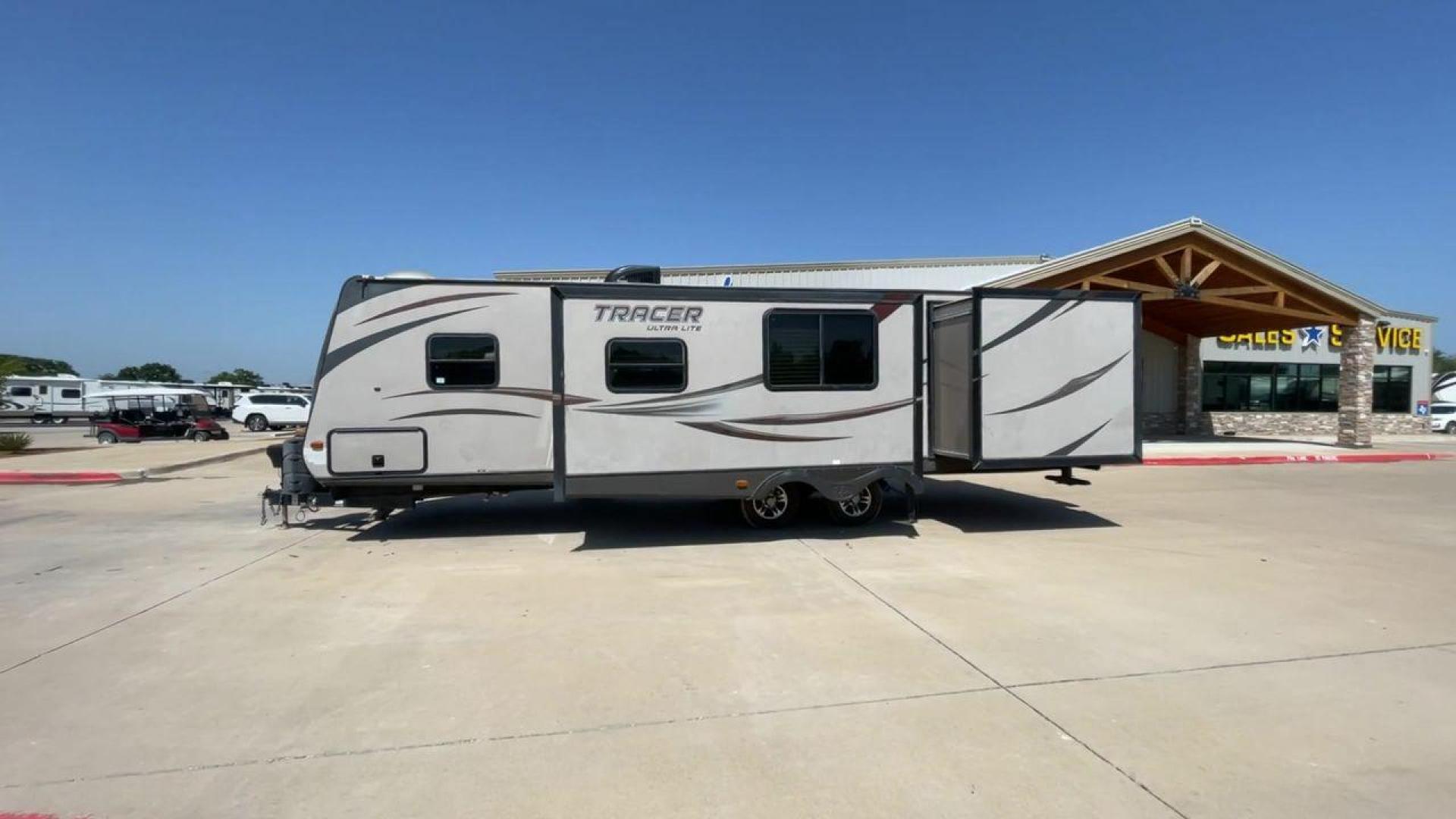 2015 WHITE FOREST RIVER TRACER 3150BHD (5ZT2TRXB5FB) , Length: 34 ft. | Dry Weight: 6,955 lbs. | Slides: 2 transmission, located at 4319 N Main Street, Cleburne, TX, 76033, (817) 221-0660, 32.435829, -97.384178 - In this 2015 Forest River Tracer 3150BHD, you are guaranteed more campers, more features, and more fun! This travel trailer measures exactly 34 ft. in length with a dry weight of 6,955 lbs. and a payload capacity of 2,755 lbs. It includes two doors, two slides, and one awning. This model featu - Photo#6