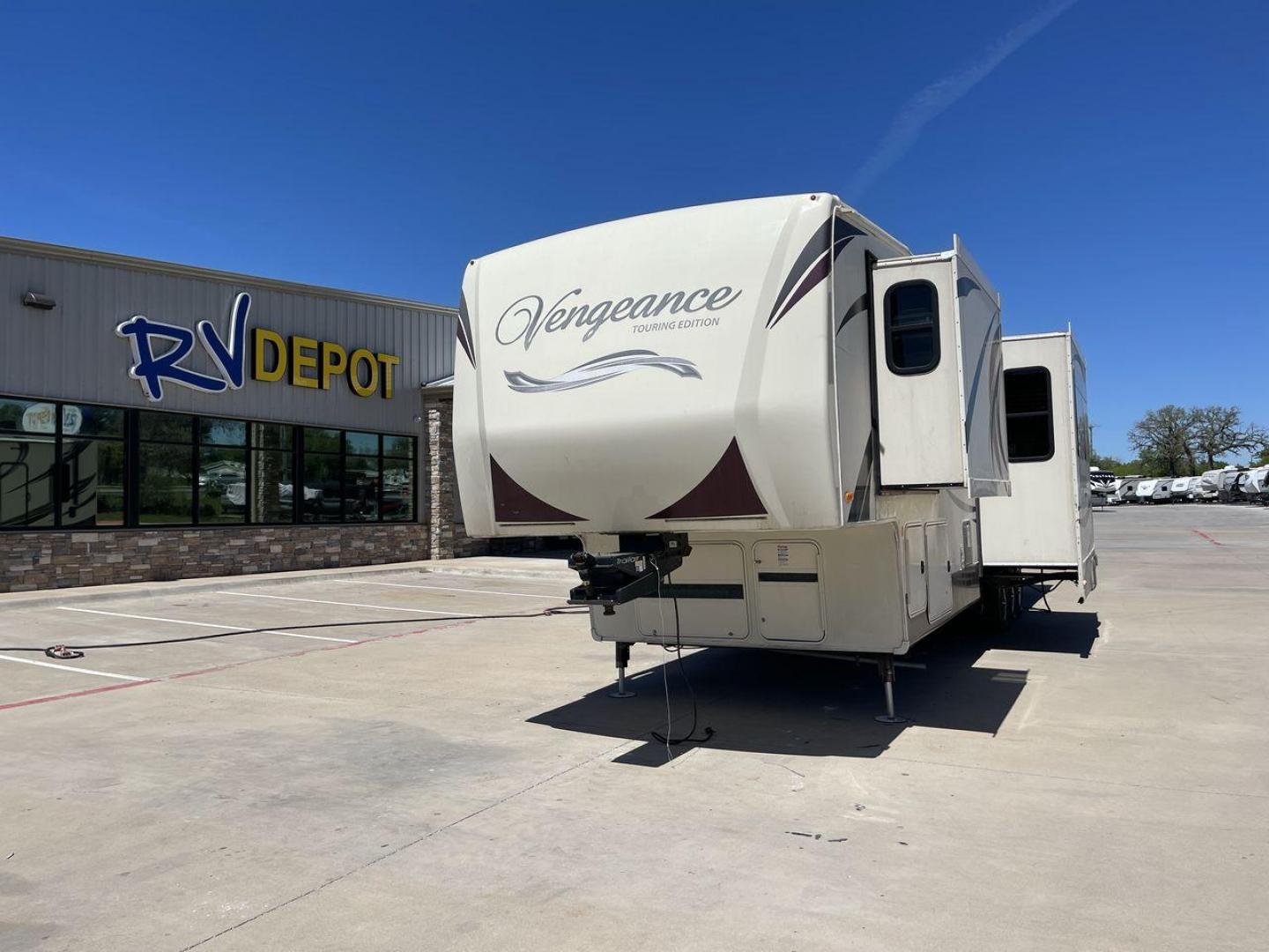 2015 TAN FOREST RIVER VENGEANCE - (4X4FVGR30FR) , Length: 42.83 ft. | Dry Weight: 14,270 lbs. | Gross Weight: 17,500 lbs. | Slides: 3 transmission, located at 4319 N Main Street, Cleburne, TX, 76033, (817) 221-0660, 32.435829, -97.384178 - Designed to provide comfort and adventure to your travels, the 2015 Forest River Vengeance 39B12 is a tough and adaptable fifth wheel toy hauler. With a dry weight of 14,270 pounds and a length of a little over 42 feet, this model offers plenty of room for your belongings while still being towable - Photo#0