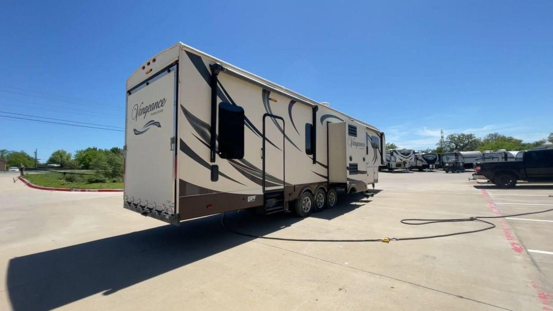 2015 TAN FOREST RIVER VENGEANCE - (4X4FVGR30FR) , Length: 42.83 ft. | Dry Weight: 14,270 lbs. | Gross Weight: 17,500 lbs. | Slides: 3 transmission, located at 4319 N Main Street, Cleburne, TX, 76033, (817) 221-0660, 32.435829, -97.384178 - Designed to provide comfort and adventure to your travels, the 2015 Forest River Vengeance 39B12 is a tough and adaptable fifth wheel toy hauler. With a dry weight of 14,270 pounds and a length of a little over 42 feet, this model offers plenty of room for your belongings while still being towable - Photo#1