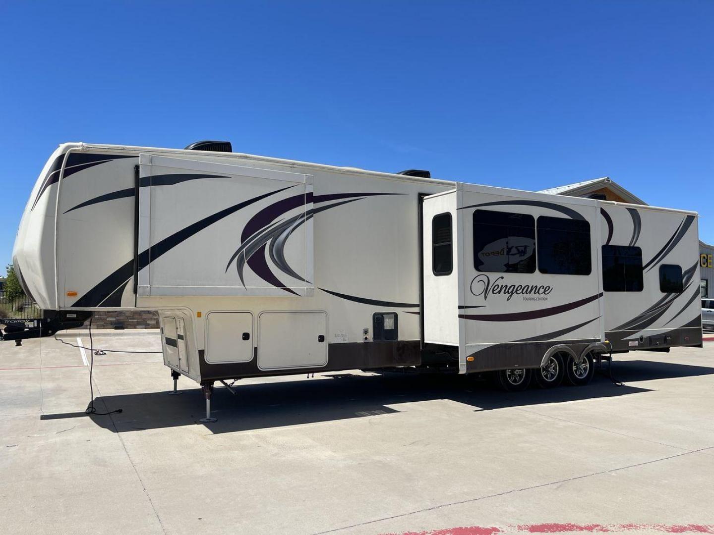 2015 TAN FOREST RIVER VENGEANCE - (4X4FVGR30FR) , Length: 42.83 ft. | Dry Weight: 14,270 lbs. | Gross Weight: 17,500 lbs. | Slides: 3 transmission, located at 4319 N Main Street, Cleburne, TX, 76033, (817) 221-0660, 32.435829, -97.384178 - Designed to provide comfort and adventure to your travels, the 2015 Forest River Vengeance 39B12 is a tough and adaptable fifth wheel toy hauler. With a dry weight of 14,270 pounds and a length of a little over 42 feet, this model offers plenty of room for your belongings while still being towable - Photo#23