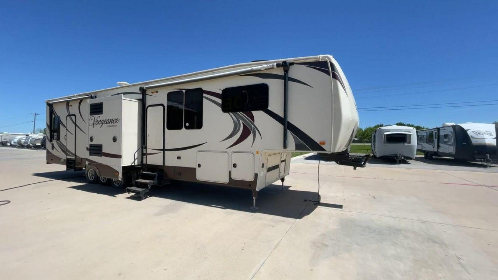 2015 TAN FOREST RIVER VENGEANCE - (4X4FVGR30FR) , Length: 42.83 ft. | Dry Weight: 14,270 lbs. | Gross Weight: 17,500 lbs. | Slides: 3 transmission, located at 4319 N Main Street, Cleburne, TX, 76033, (817) 221-0660, 32.435829, -97.384178 - Designed to provide comfort and adventure to your travels, the 2015 Forest River Vengeance 39B12 is a tough and adaptable fifth wheel toy hauler. With a dry weight of 14,270 pounds and a length of a little over 42 feet, this model offers plenty of room for your belongings while still being towable - Photo#3