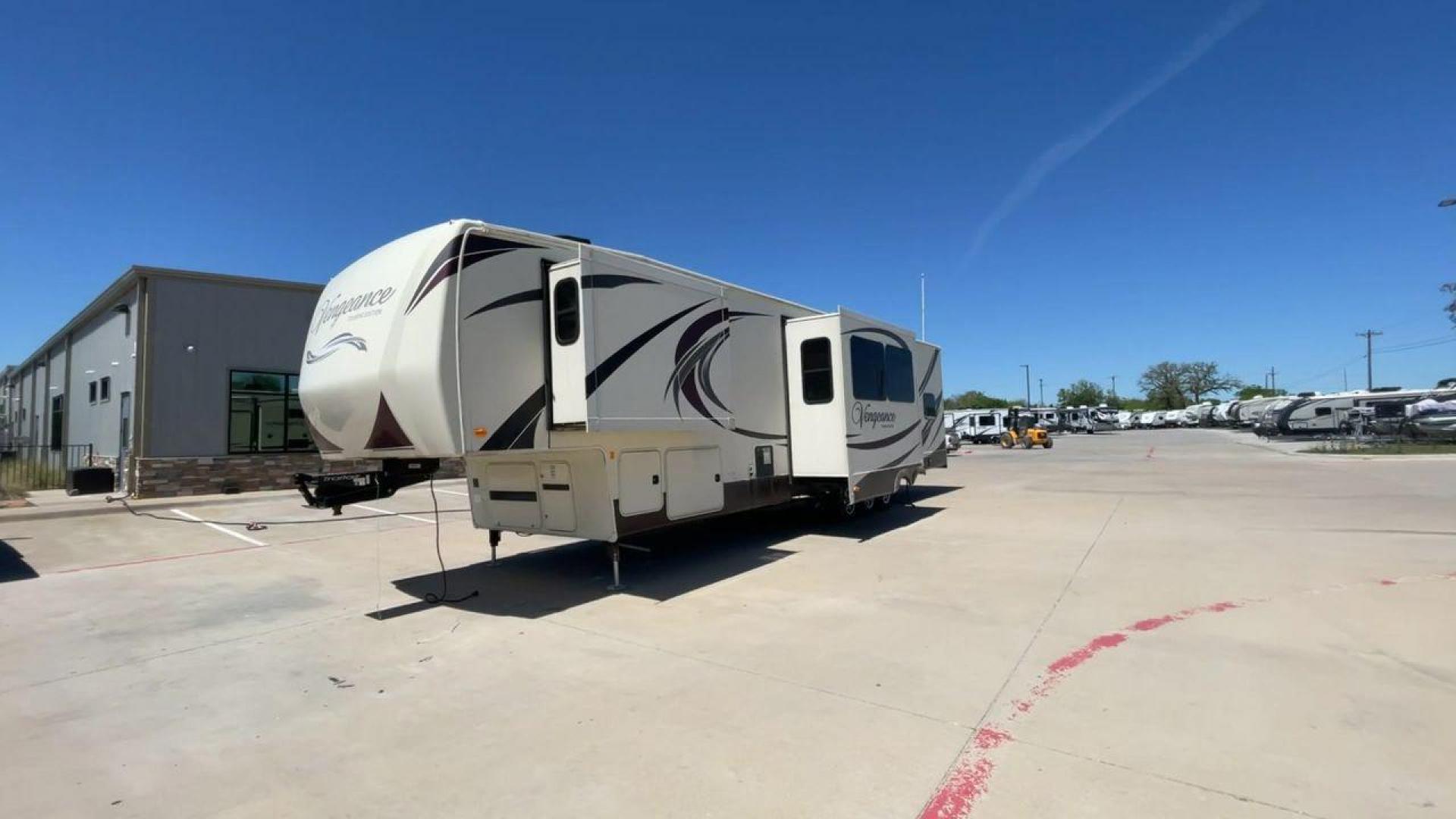 2015 TAN FOREST RIVER VENGEANCE - (4X4FVGR30FR) , Length: 42.83 ft. | Dry Weight: 14,270 lbs. | Gross Weight: 17,500 lbs. | Slides: 3 transmission, located at 4319 N Main Street, Cleburne, TX, 76033, (817) 221-0660, 32.435829, -97.384178 - Designed to provide comfort and adventure to your travels, the 2015 Forest River Vengeance 39B12 is a tough and adaptable fifth wheel toy hauler. With a dry weight of 14,270 pounds and a length of a little over 42 feet, this model offers plenty of room for your belongings while still being towable - Photo#5