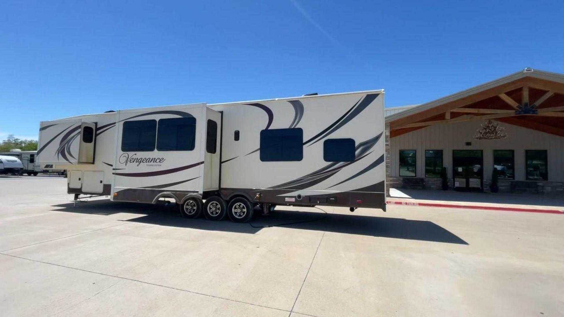 2015 TAN FOREST RIVER VENGEANCE - (4X4FVGR30FR) , Length: 42.83 ft. | Dry Weight: 14,270 lbs. | Gross Weight: 17,500 lbs. | Slides: 3 transmission, located at 4319 N Main Street, Cleburne, TX, 76033, (817) 221-0660, 32.435829, -97.384178 - Designed to provide comfort and adventure to your travels, the 2015 Forest River Vengeance 39B12 is a tough and adaptable fifth wheel toy hauler. With a dry weight of 14,270 pounds and a length of a little over 42 feet, this model offers plenty of room for your belongings while still being towable - Photo#7