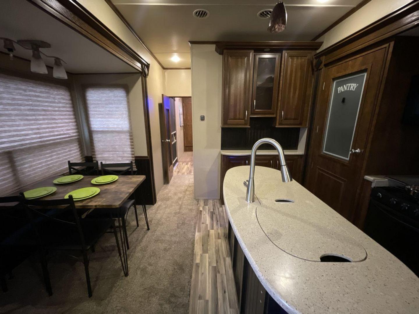 2015 BEIGE GRAND DESIGN SOLITUDE 379FL (573FS4325F1) , Length: 42.5 ft. | Dry Weight: 13,800 lbs. | Gross Weight: 16,000 lbs. | Slides: 5 transmission, located at 4319 N Main Street, Cleburne, TX, 76033, (817) 221-0660, 32.435829, -97.384178 - This 2015 GRSL Solitude 379 fifth wheel measures just over 42' in length. It is a dual axle and aluminum wheel setup with a GCWR of 16,000 lbs and a carrying capacity of 2,200 lbs. With five slides, this fifth wheel is spacious and comfortable! The Solitude's exterior is made from fiberglass, finish - Photo#12