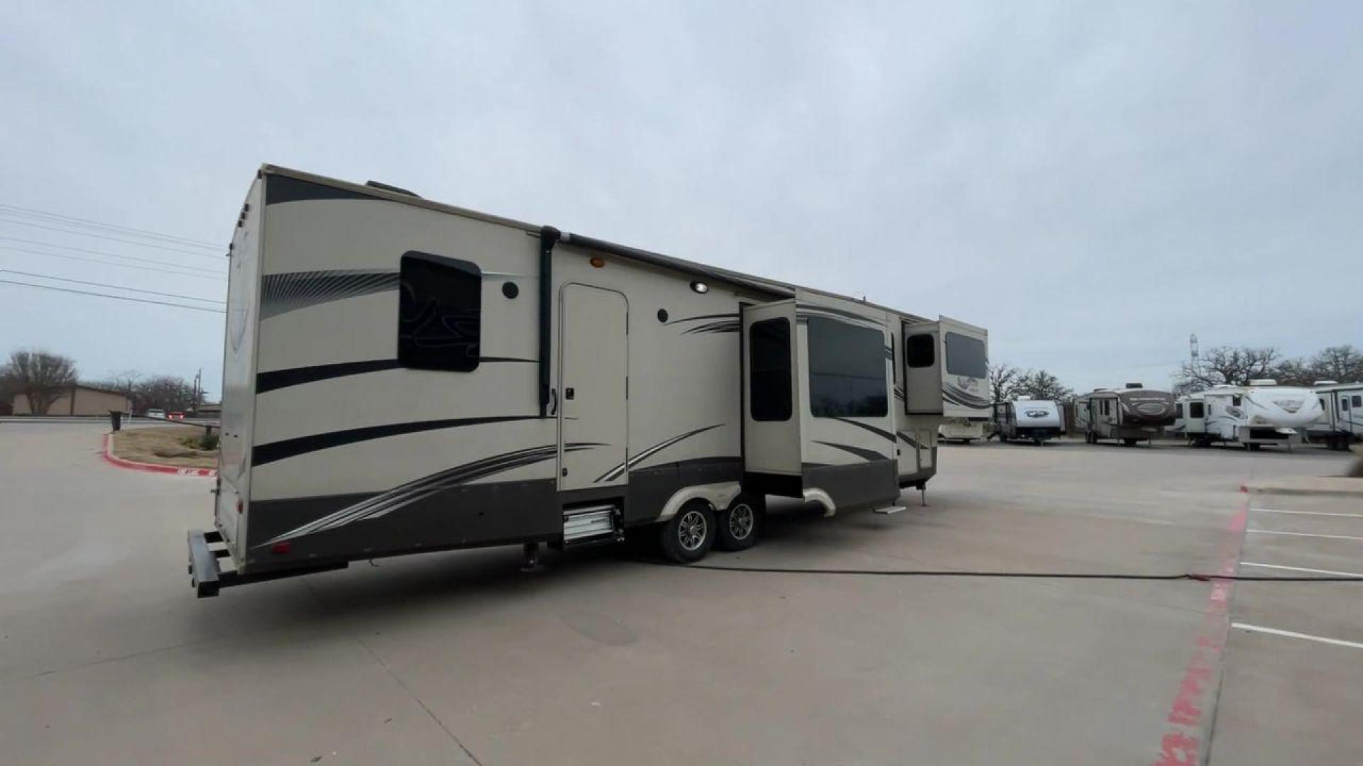 2015 BEIGE GRAND DESIGN SOLITUDE 379FL (573FS4325F1) , Length: 42.5 ft. | Dry Weight: 13,800 lbs. | Gross Weight: 16,000 lbs. | Slides: 5 transmission, located at 4319 N Main Street, Cleburne, TX, 76033, (817) 221-0660, 32.435829, -97.384178 - This 2015 GRSL Solitude 379 fifth wheel measures just over 42' in length. It is a dual axle and aluminum wheel setup with a GCWR of 16,000 lbs and a carrying capacity of 2,200 lbs. With five slides, this fifth wheel is spacious and comfortable! The Solitude's exterior is made from fiberglass, finish - Photo#1