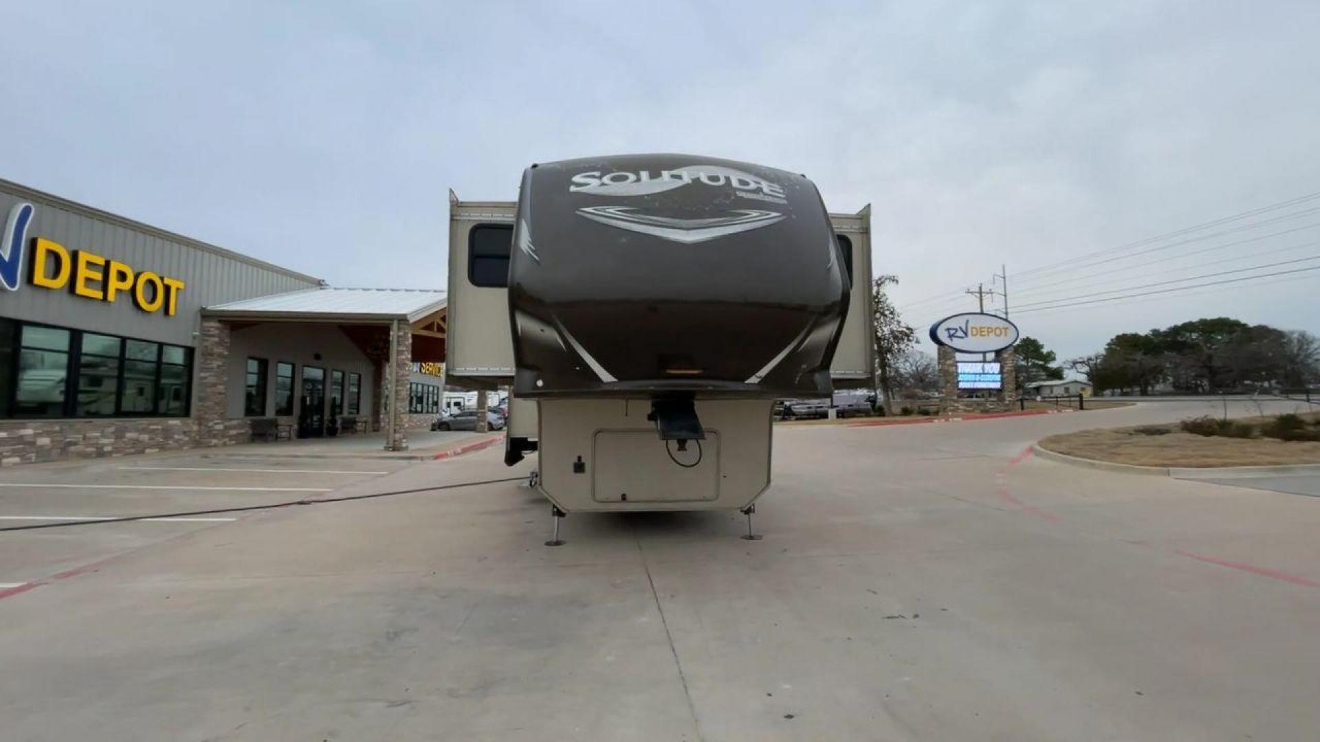 2015 BEIGE GRAND DESIGN SOLITUDE 379FL (573FS4325F1) , Length: 42.5 ft. | Dry Weight: 13,800 lbs. | Gross Weight: 16,000 lbs. | Slides: 5 transmission, located at 4319 N Main Street, Cleburne, TX, 76033, (817) 221-0660, 32.435829, -97.384178 - This 2015 GRSL Solitude 379 fifth wheel measures just over 42' in length. It is a dual axle and aluminum wheel setup with a GCWR of 16,000 lbs and a carrying capacity of 2,200 lbs. With five slides, this fifth wheel is spacious and comfortable! The Solitude's exterior is made from fiberglass, finish - Photo#4