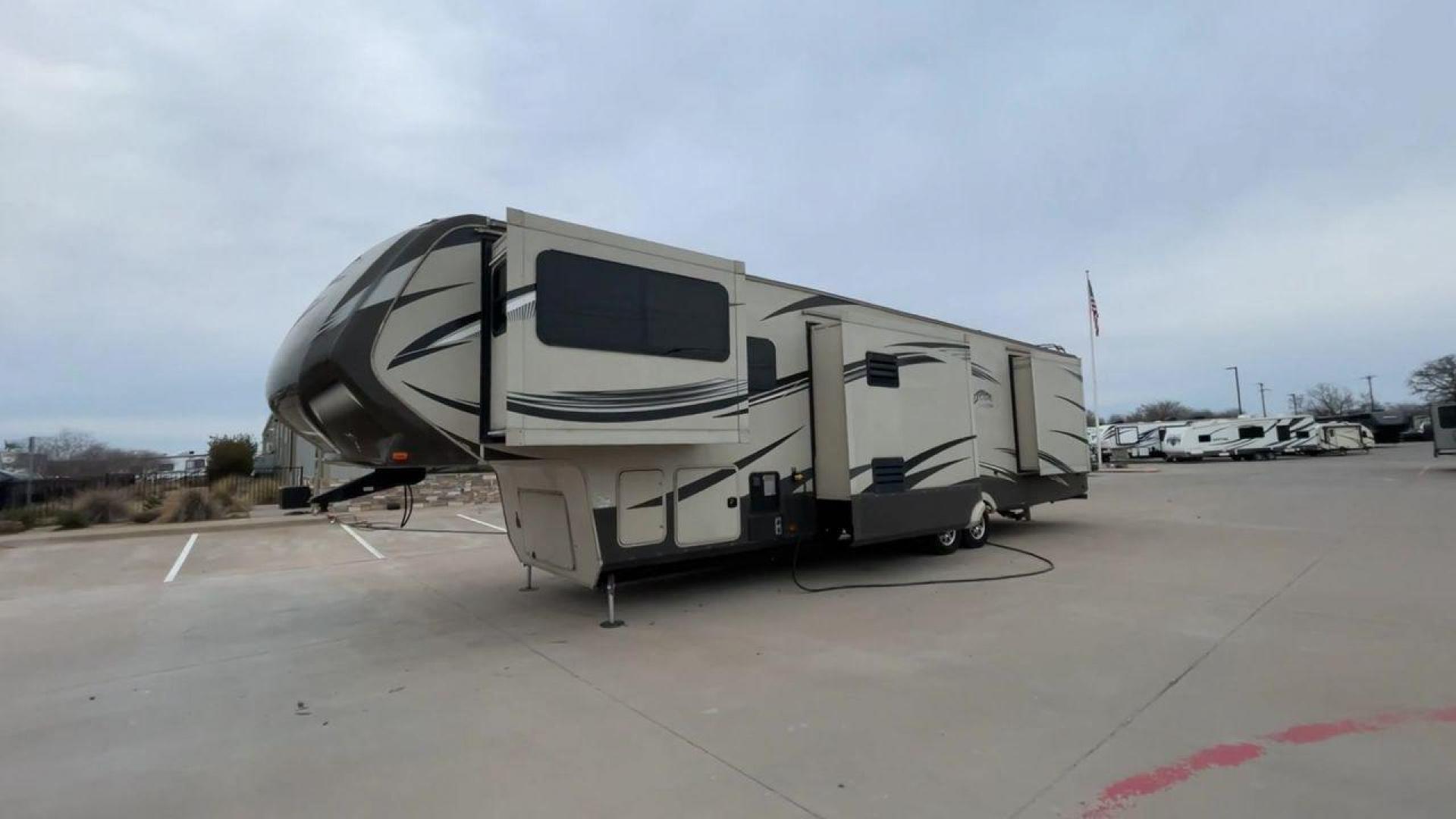 2015 BEIGE GRAND DESIGN SOLITUDE 379FL (573FS4325F1) , Length: 42.5 ft. | Dry Weight: 13,800 lbs. | Gross Weight: 16,000 lbs. | Slides: 5 transmission, located at 4319 N Main Street, Cleburne, TX, 76033, (817) 221-0660, 32.435829, -97.384178 - This 2015 GRSL Solitude 379 fifth wheel measures just over 42' in length. It is a dual axle and aluminum wheel setup with a GCWR of 16,000 lbs and a carrying capacity of 2,200 lbs. With five slides, this fifth wheel is spacious and comfortable! The Solitude's exterior is made from fiberglass, finish - Photo#5