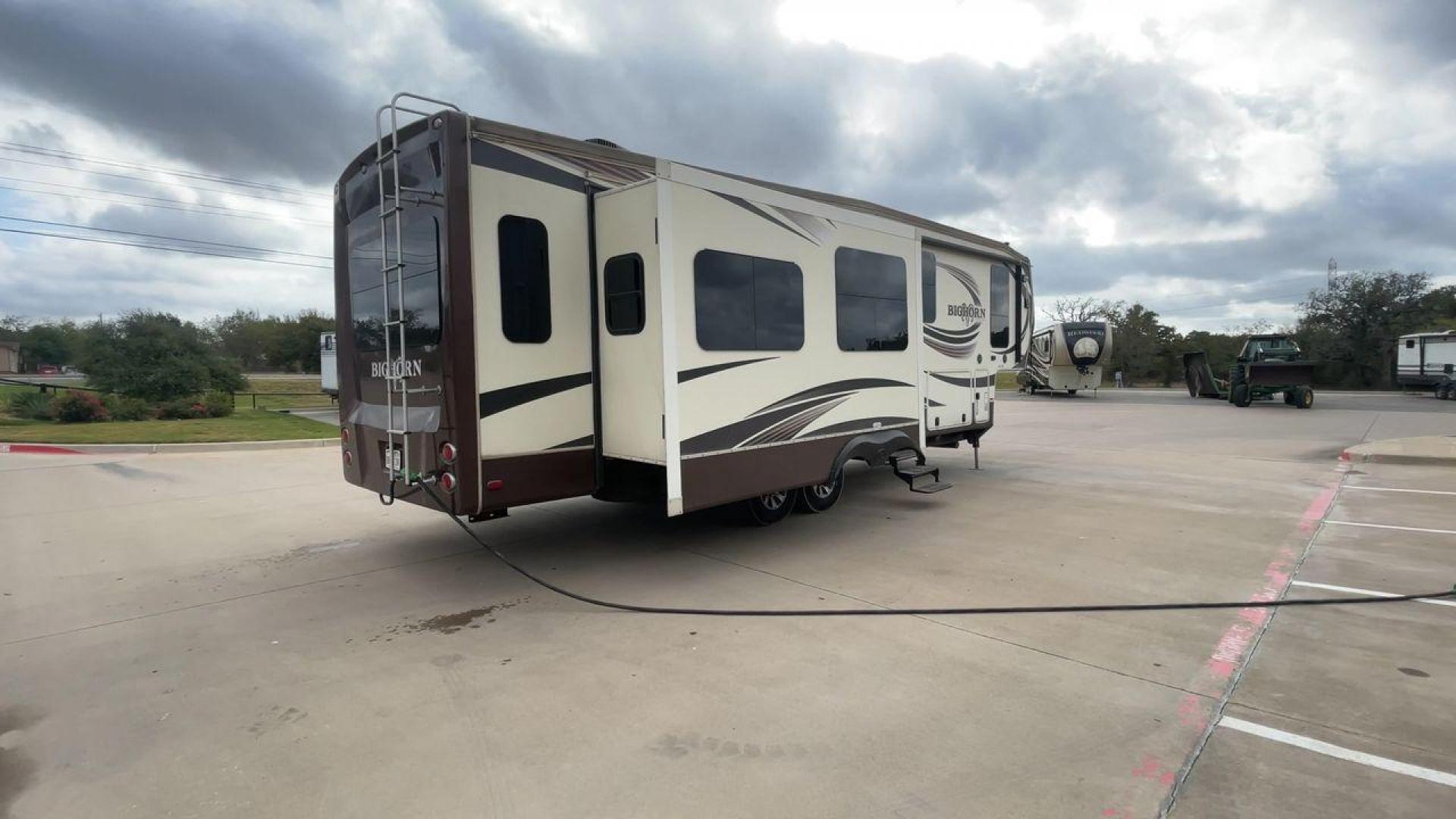 2015 HEARTLAND BIGHORN 3270RS (5SFBG3521FE) , Length: 36.6 ft. | Gross Weight: 15,500 lbs. | Slides: 3 transmission, located at 4319 N Main Street, Cleburne, TX, 76033, (817) 221-0660, 32.435829, -97.384178 - The 2015 Heartland Bighorn 3270RS is a luxurious fifth wheel designed for comfort and quality, ideal for couples or small families seeking an upscale, spacious RV with residential-style amenities. This model is perfect for extended stays, featuring high-end finishes and an open floor plan. The dimen - Photo#1