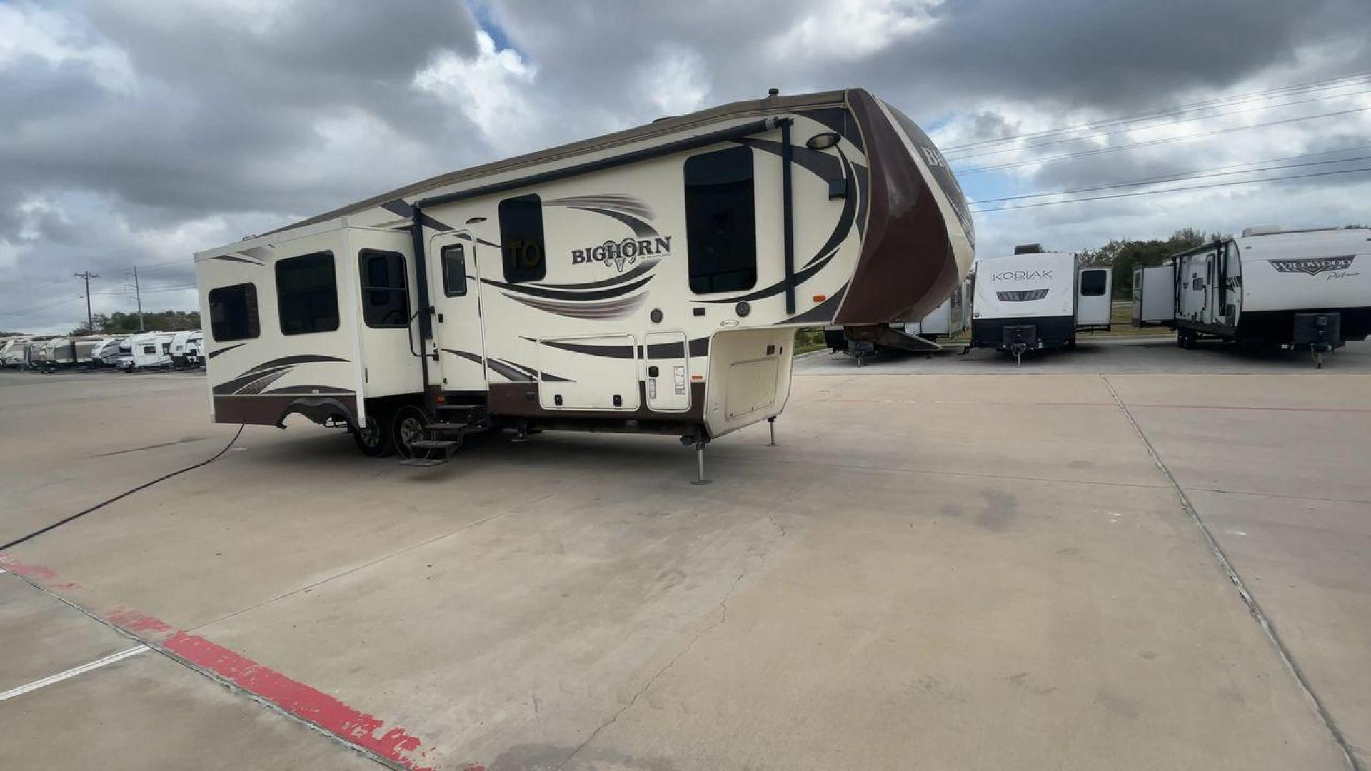 2015 HEARTLAND BIGHORN 3270RS (5SFBG3521FE) , Length: 36.6 ft. | Gross Weight: 15,500 lbs. | Slides: 3 transmission, located at 4319 N Main Street, Cleburne, TX, 76033, (817) 221-0660, 32.435829, -97.384178 - The 2015 Heartland Bighorn 3270RS is a luxurious fifth wheel designed for comfort and quality, ideal for couples or small families seeking an upscale, spacious RV with residential-style amenities. This model is perfect for extended stays, featuring high-end finishes and an open floor plan. The dimen - Photo#3