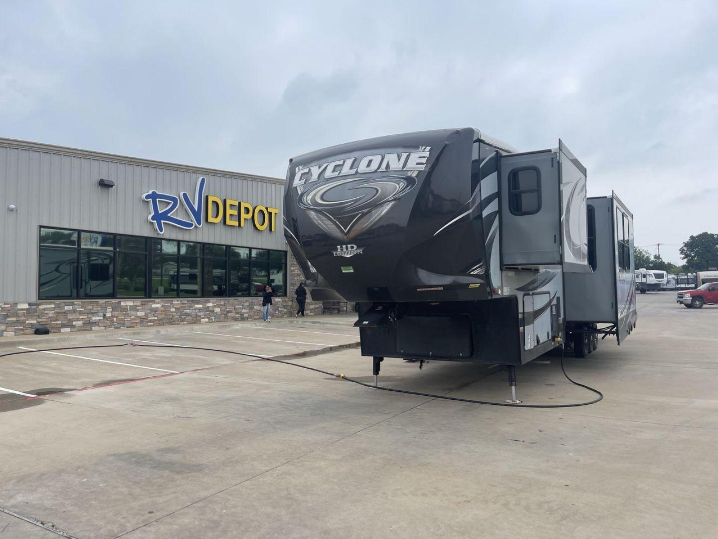 2015 GRAY HEARTLAND CYCLONE 4200 (5SFCG4430FE) , Length: 44 ft | Dry Weight: 15,725 lbs. | Gross Weight: 20,000 lbs. | Slides: 2 transmission, located at 4319 N Main Street, Cleburne, TX, 76033, (817) 221-0660, 32.435829, -97.384178 - Embark on an exciting journey with the 2015 Heartland Cyclone 4200 Toy Hauler, a cutting-edge RV built to cater to your living needs while also allowing you to bring along your beloved toys. This 44-foot marvel features a toy hauler floorplan, combining functionality with luxury for the ultimate rec - Photo#0