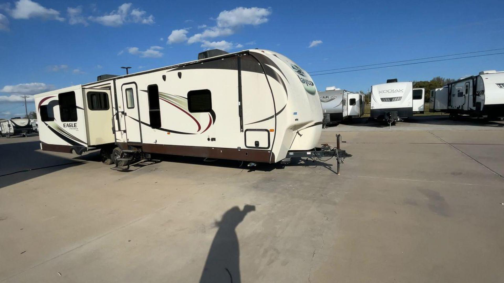 2015 BEIGE JAYCO EAGLE 338RETS - (1UJBJ0BU6F1) , Length: 39.2 ft. | Dry Weight: 8,710 lbs. | Gross Weight: 10,950 lbs. | Slides: 3 transmission, located at 4319 N Main Street, Cleburne, TX, 76033, (817) 221-0660, 32.435829, -97.384178 - This 2015 Jayco Eagle 338RETS travel trailer measures just under 40' in length. It is a dual axle, aluminum wheel setup with a GVWR of 10,950 lbs and has a carrying capacity of 2,240 lbs. With three slides, this travel trailer is open and spacious!Constructed with an aluminum body and featuring fibe - Photo#3