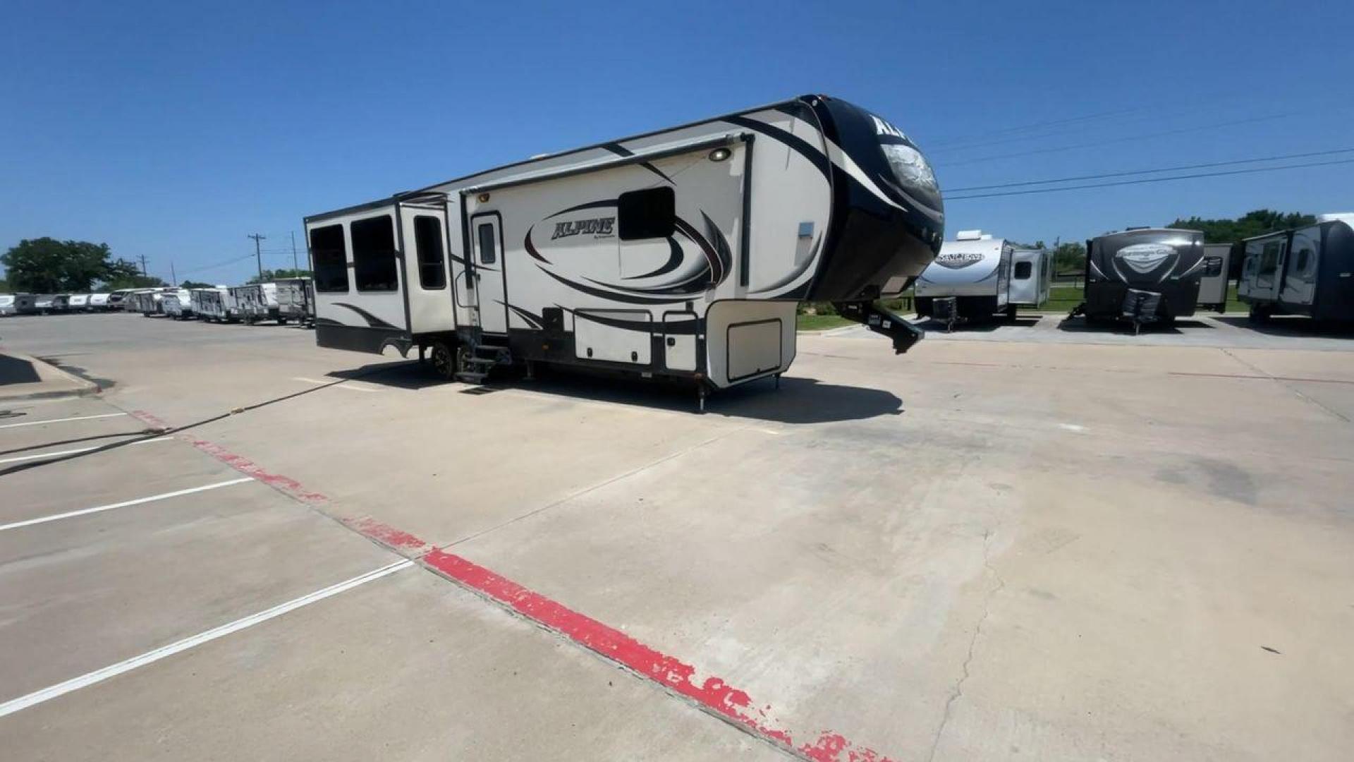 2015 WHITE KEYSTONE ALPINE 3535RE (4YDF35320FE) , Length: 39.08 ft. | Dry Weight: 12,416 lbs. | Gross Weight: 15,500 lbs. | Slides: 4 transmission, located at 4319 N Main Street, Cleburne, TX, 76033, (817) 221-0660, 32.435829, -97.384178 - Improve your RV experience with the 2015 Keystone Alpine 3535RE, a high-end fifth wheel that embodies ease and style. This model, which is an impressive 39.08 feet long, was carefully made for discerning travelers who want a perfect mix of style and usefulness. Because it is made of an aluminum body - Photo#3