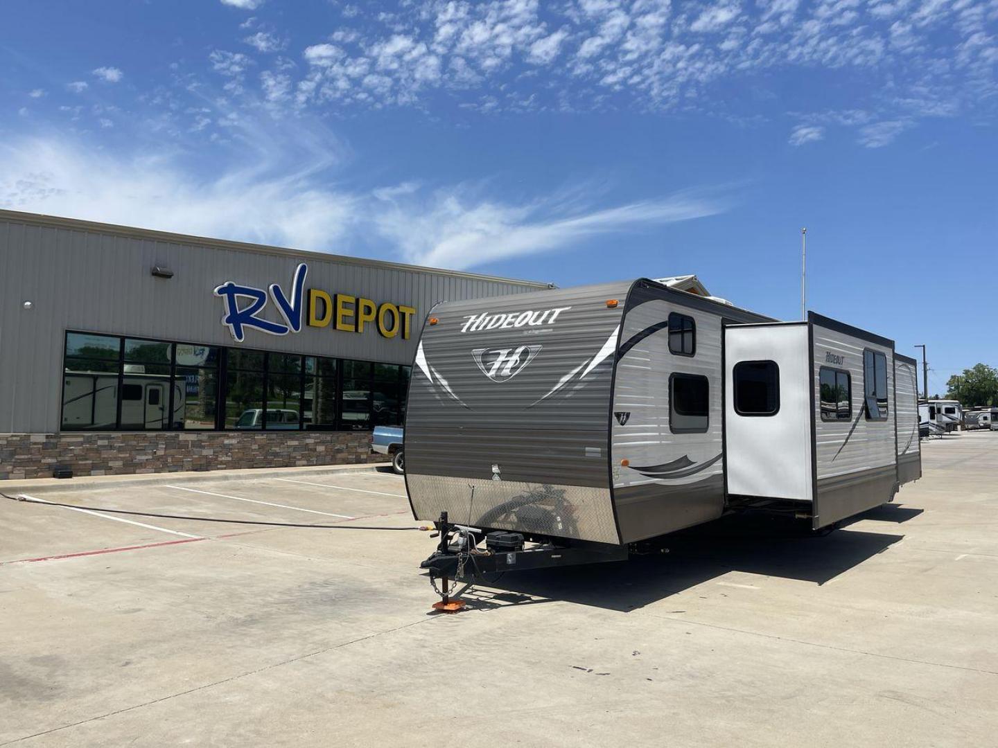 2015 KEYSTONE HIDEOUT 38BHDS (4YDT38B21F7) , Length: 39.83 ft. | Dry Weight: 8,420 lbs. | Gross Weight: 10,010 lbs. | Slides: 2 transmission, located at 4319 N Main Street, Cleburne, TX, 76033, (817) 221-0660, 32.435829, -97.384178 - Measuring 39.83 feet in length and boasting a dry weight of 8,420 lbs, the Hideout is both spacious and lightweight, making it easy to tow and maneuver. With a gross weight of 10,010 lbs, you'll have plenty of room for all your gear and supplies. With a wood body and aluminum sides, this trailer is - Photo#0