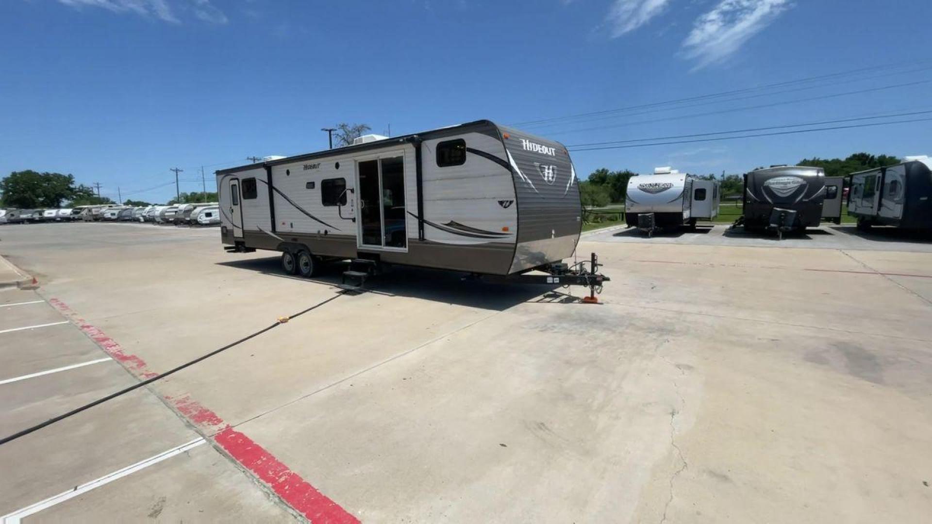 2015 KEYSTONE HIDEOUT 38BHDS (4YDT38B21F7) , Length: 39.83 ft. | Dry Weight: 8,420 lbs. | Gross Weight: 10,010 lbs. | Slides: 2 transmission, located at 4319 N Main Street, Cleburne, TX, 76033, (817) 221-0660, 32.435829, -97.384178 - Measuring 39.83 feet in length and boasting a dry weight of 8,420 lbs, the Hideout is both spacious and lightweight, making it easy to tow and maneuver. With a gross weight of 10,010 lbs, you'll have plenty of room for all your gear and supplies. With a wood body and aluminum sides, this trailer is - Photo#3