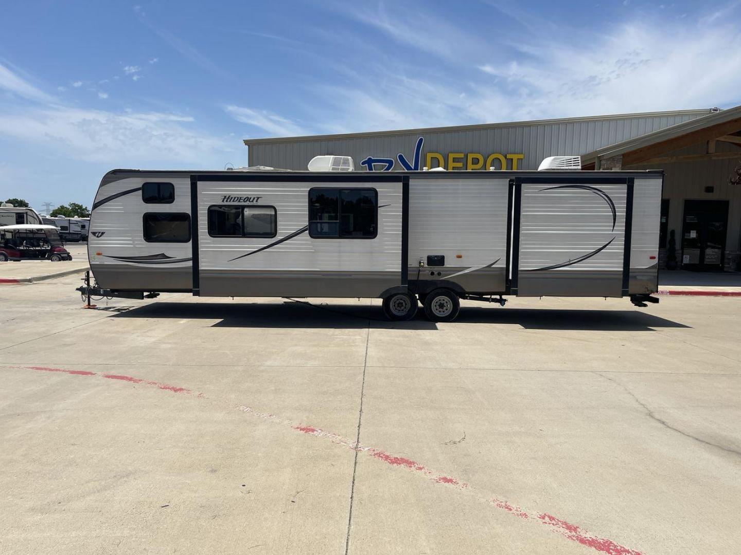 2015 KEYSTONE HIDEOUT 38BHDS (4YDT38B21F7) , Length: 39.83 ft. | Dry Weight: 8,420 lbs. | Gross Weight: 10,010 lbs. | Slides: 2 transmission, located at 4319 N Main Street, Cleburne, TX, 76033, (817) 221-0660, 32.435829, -97.384178 - Measuring 39.83 feet in length and boasting a dry weight of 8,420 lbs, the Hideout is both spacious and lightweight, making it easy to tow and maneuver. With a gross weight of 10,010 lbs, you'll have plenty of room for all your gear and supplies. With a wood body and aluminum sides, this trailer is - Photo#24